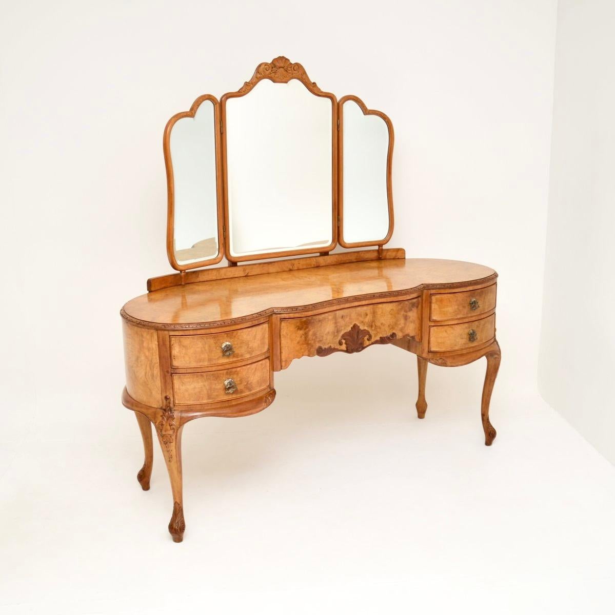 A stunning antique burr walnut dressing table and stool, made in England and dating from the 1920’s.

They are of outstanding quality, really well made and beautifully designed. The dressing table is a great size, it is wide and very impressive,