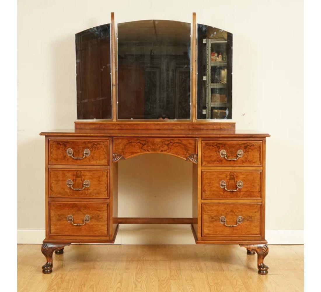 We are delighted to offer for sale this lovely Antique burr walnut dressing table with carved feet.

The dressing table contains seven drawers with plenty of room for storage. The desk overall is in excellent condition. The mirrors are removable.