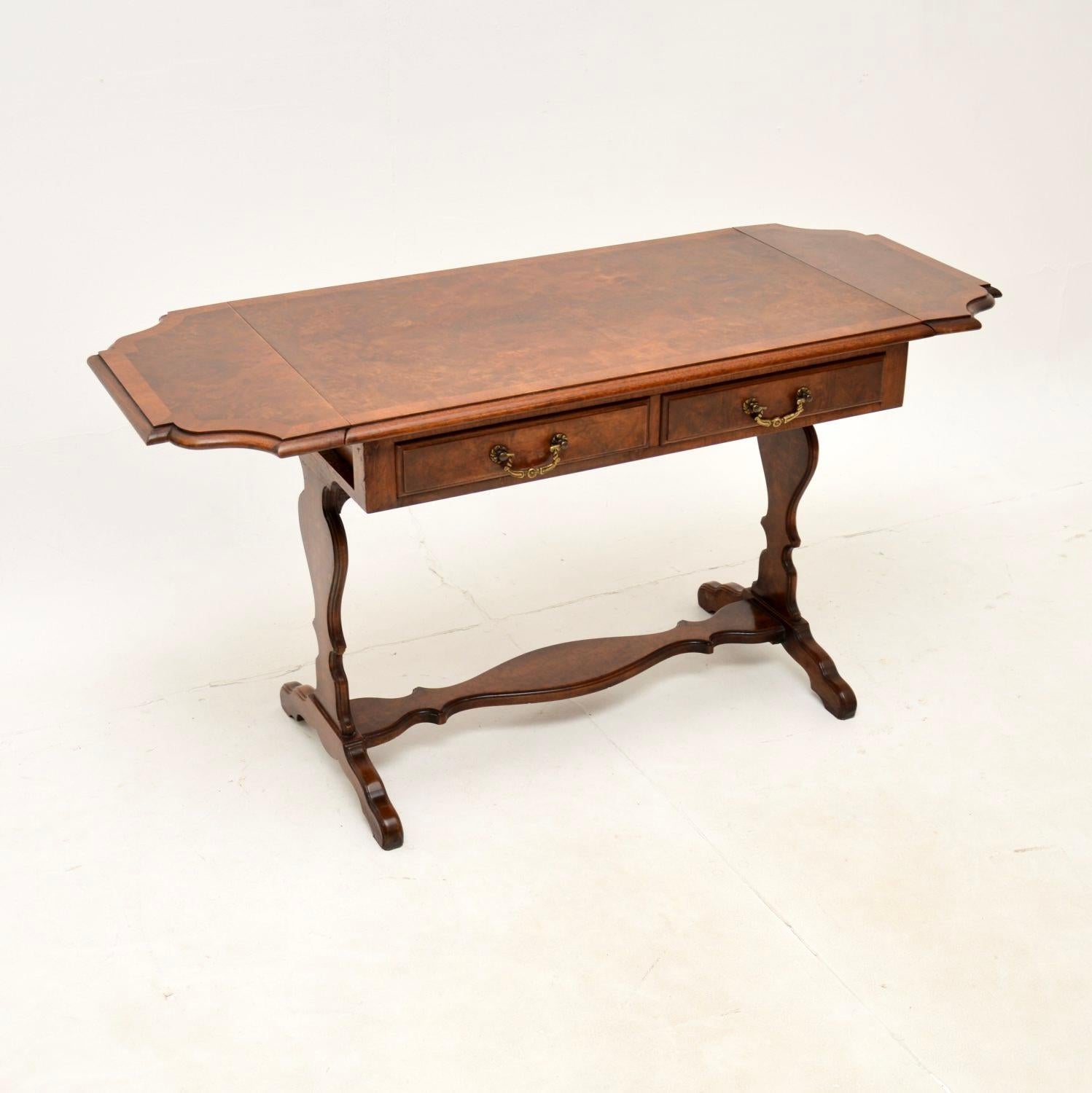 A beautiful antique burr walnut drop leaf coffee / side table. This was made in England, it dates from around the 1930’s.

It is very well made and is of excellent quality. It is a useful size, and the drop ends can be lifted to extend the surface.