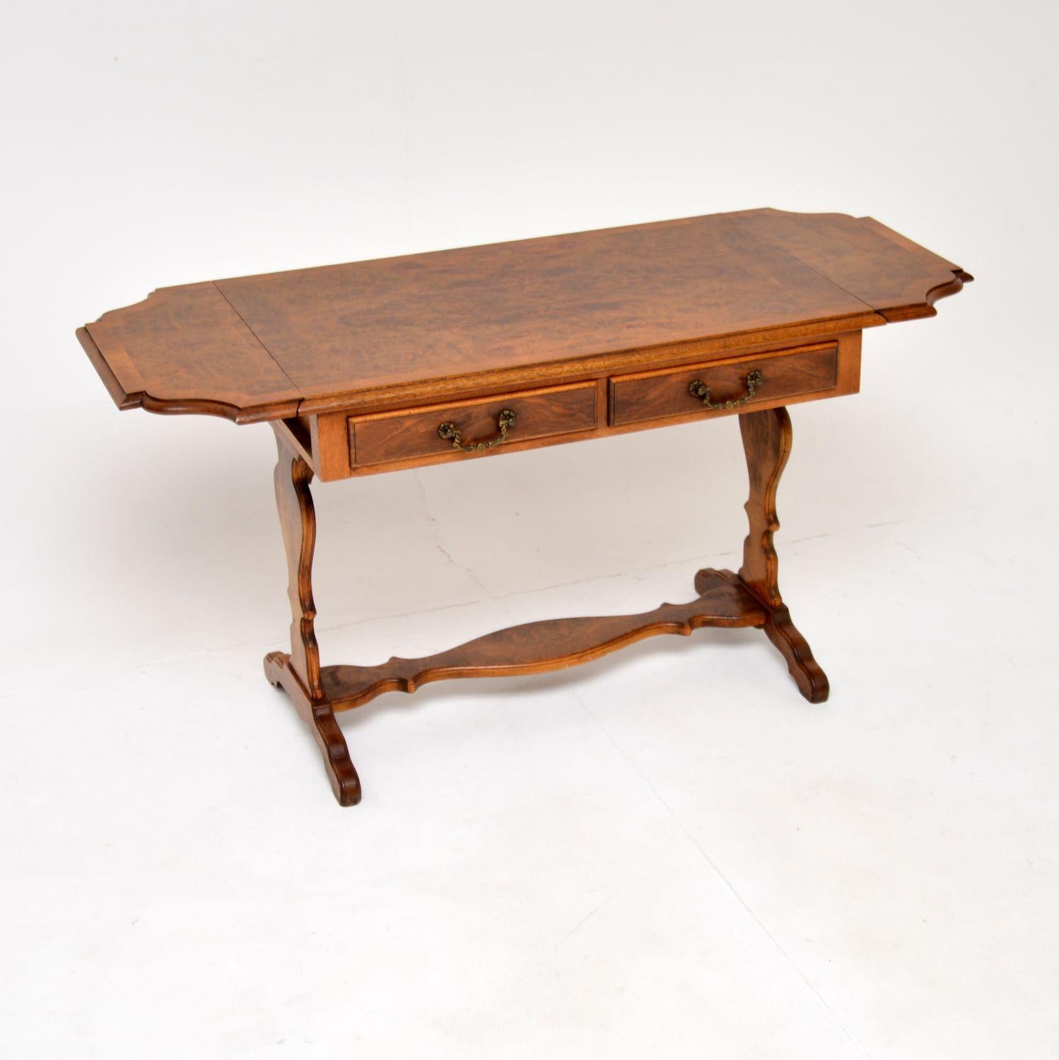 A beautiful antique drop leaf coffee table or side table in burr walnut. This was made in England, it dates from around the 1930’s.

It is very well made and is of excellent quality. It is a useful size, and the drop ends can be lifted to extend the