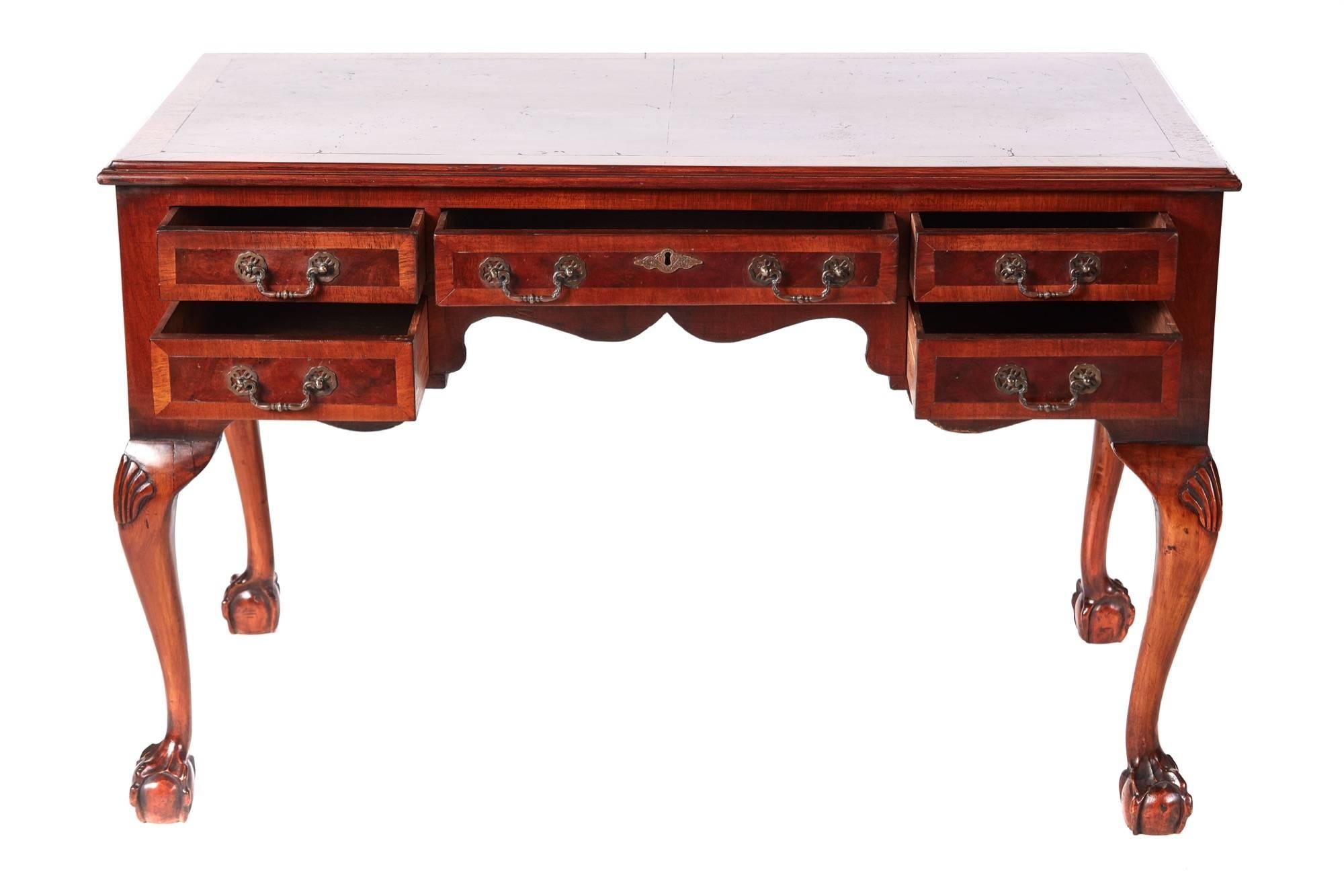 Antique burr walnut freestanding writing desk, having a lovely burr walnut crossbanded top, five crossbanded walnut drawers all with original brass handles, standing on shaped carved cabriole legs with claw and ball feet
Lovely color and