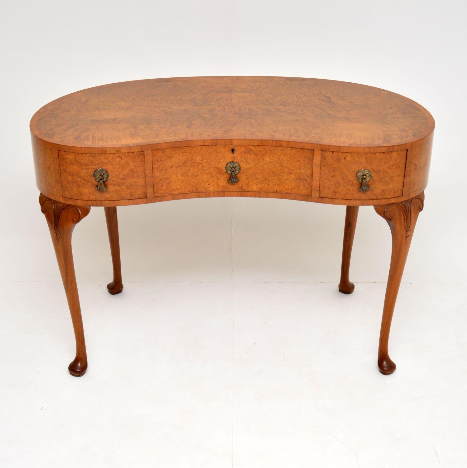 Fine quality antique burr walnut kidney shaped desk or dressing table which was designed & made by “Waring & Gillows”. The metal label in attached to the inside of one of the drawers.

It’s finished & polished all the way around, with a