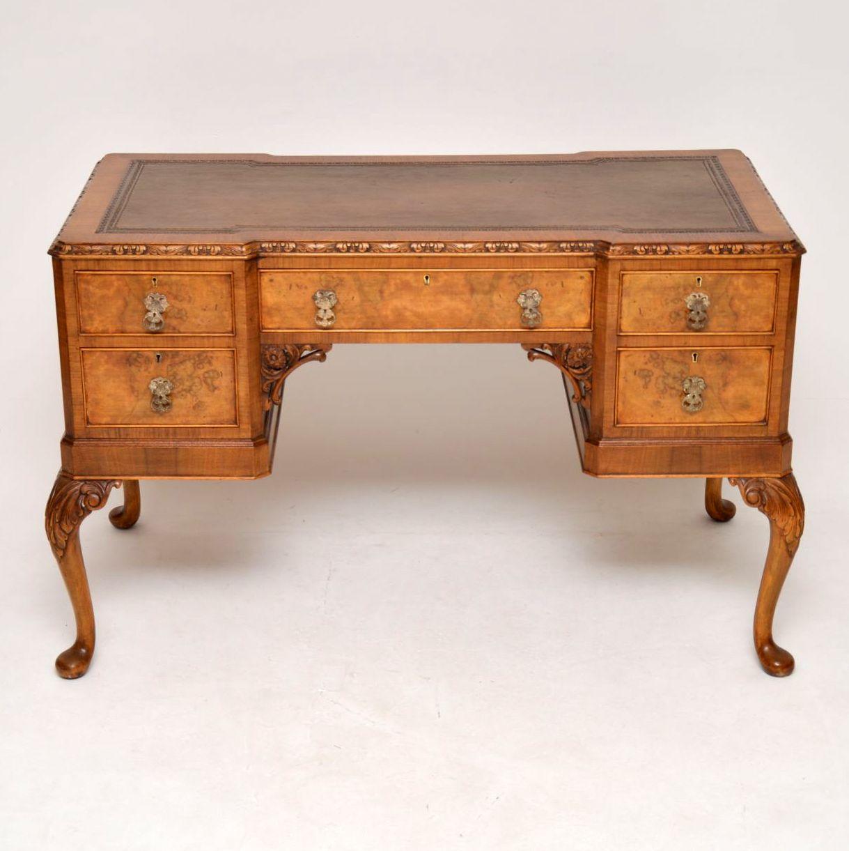 Great looking antique walnut desk dating from the 1920s period with a lovely mellow color and in excellent condition. This desk is of extremely high quality and has plenty of detailed carvings. The back is finished off as nice as the front and both