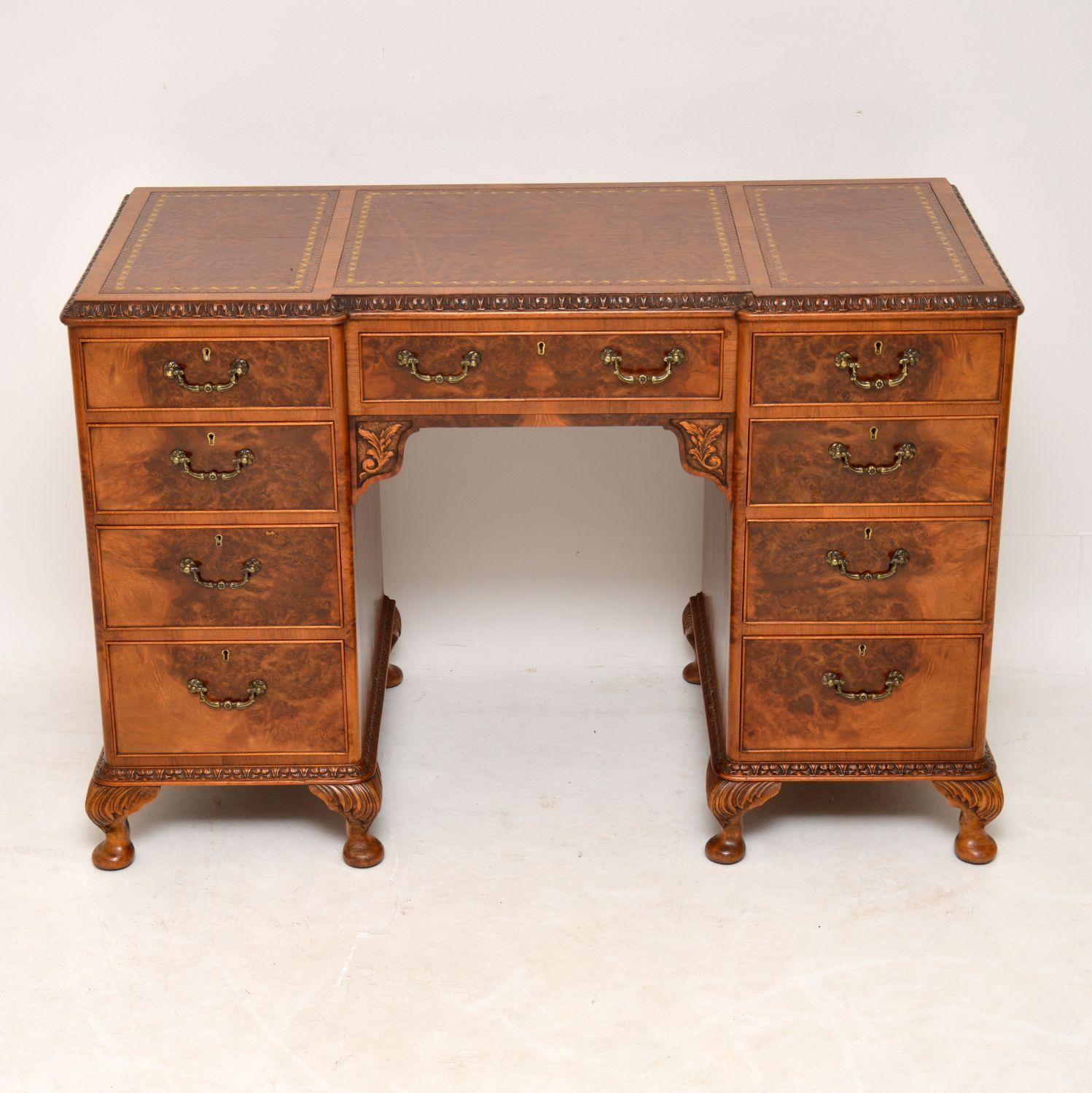 High quality antique Queen Anne style burr walnut leather top desk in very good original condition and dating from circa 1920s period. There is a wonderful pattern of burr walnut all-over this desk, on the front, sides, back and even the insides of