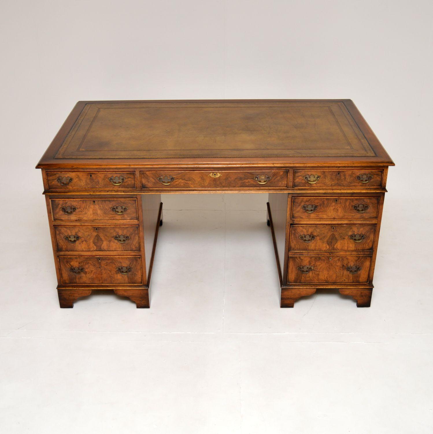 A fantastic antique burr walnut leather top partners desk. This was made in England, it dates from around the 1950’s.

It is of exceptional quality and is a great size, it is finished on both sides with useful cabinets and dummy drawers on the back.