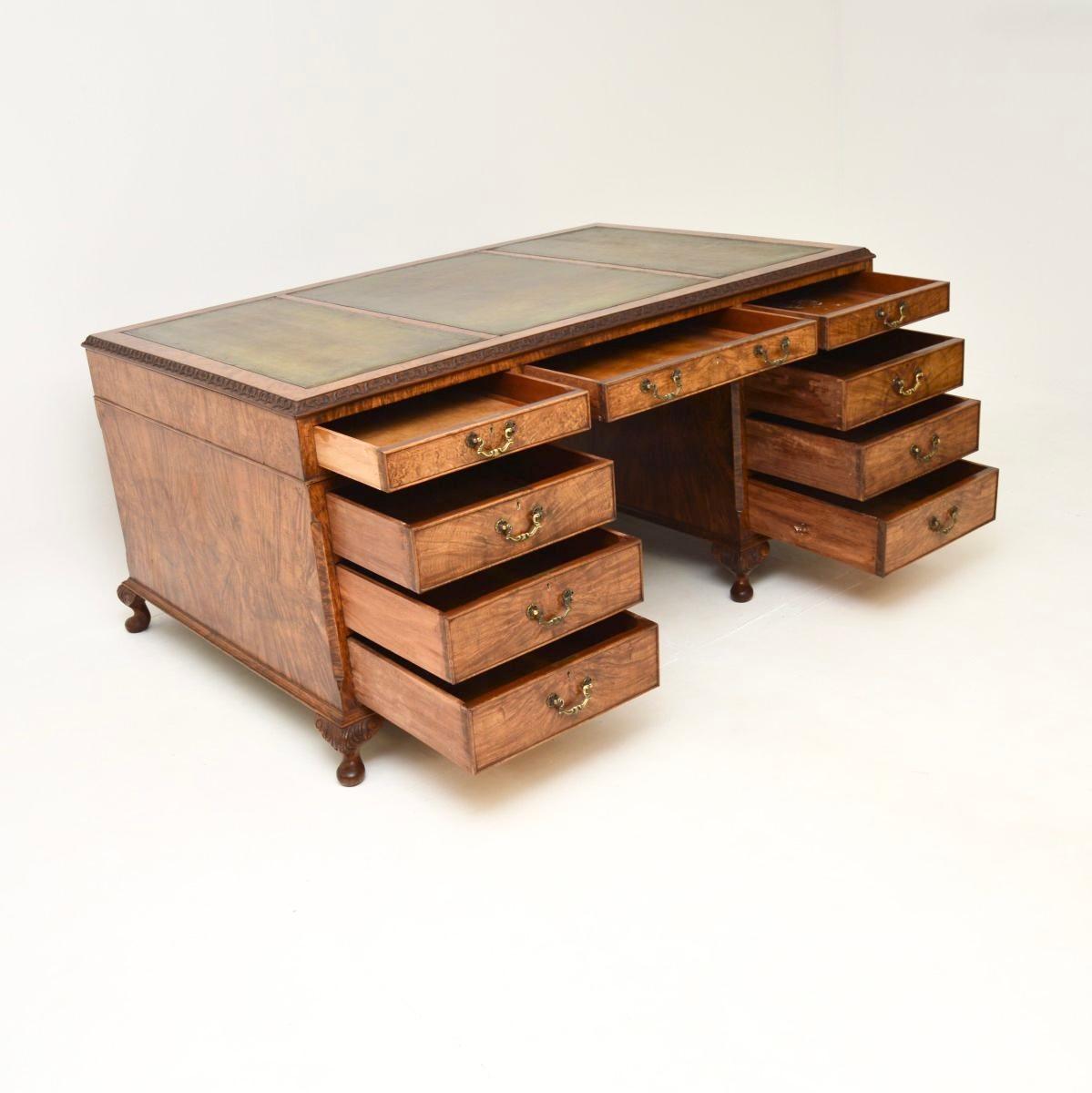 A stunning and very impressive antique burr walnut leather top partners desk. This was made in England, it dates from around the 1920’s.

The quality is outstanding, this is extremely well made and beautifully designed. There are gorgeous walnut