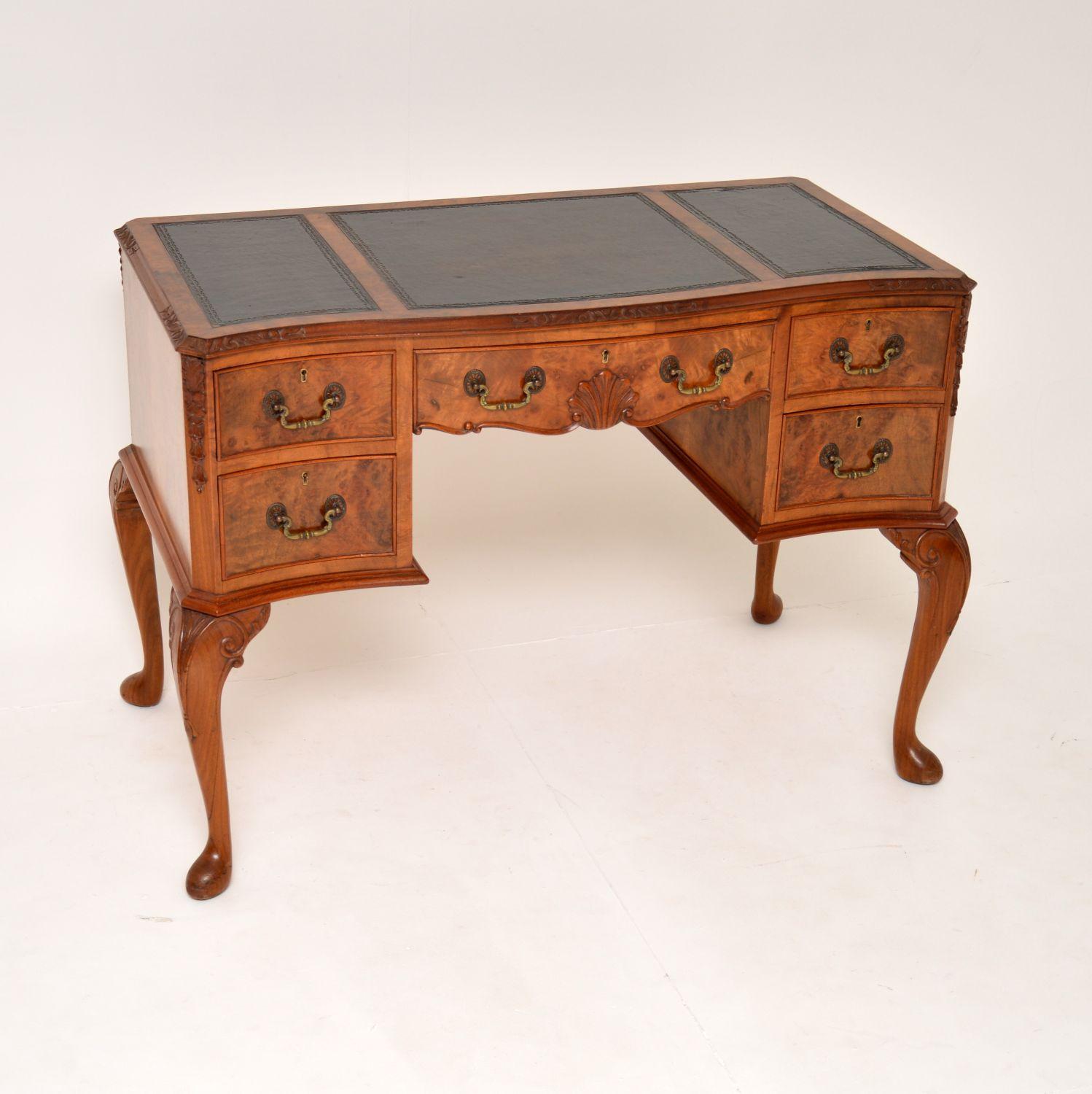 An excellent antique burr walnut writing desk of lovely proportions. This was made in England, it dates from around the 1900-1920’s. The quality is outstanding, this has absolutely gorgeous burr walnut grain patterns throughout, even on the back.