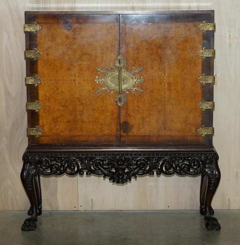 We are delighted to offer for sale this absolutely exquisite, circa 1880 hand made in England Burr walnut drinks cabinet with oversized brass fixtures and fittings and hand carved Lion’s Hairy paw feet

This piece is really stunning, it is the