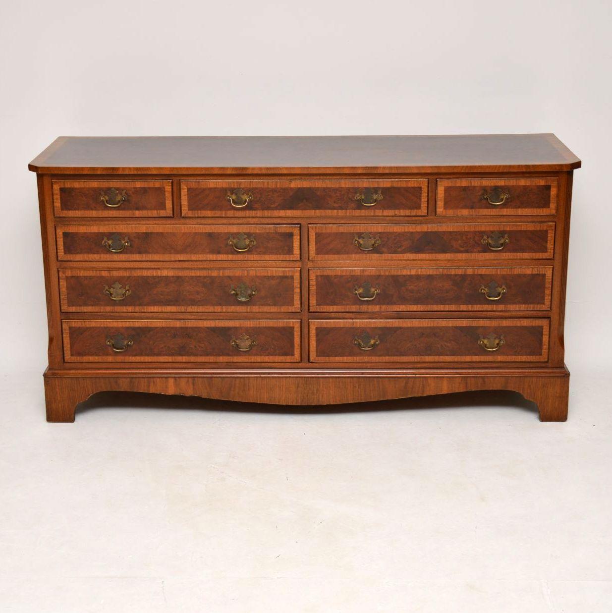 This antique Georgian style burr walnut long low chest of drawers, is a very useful item and would be ideal for placing a large T.V screen on top of. The top is burr walnut surrounded by a figured walnut cross banding. All the drawer fronts are a