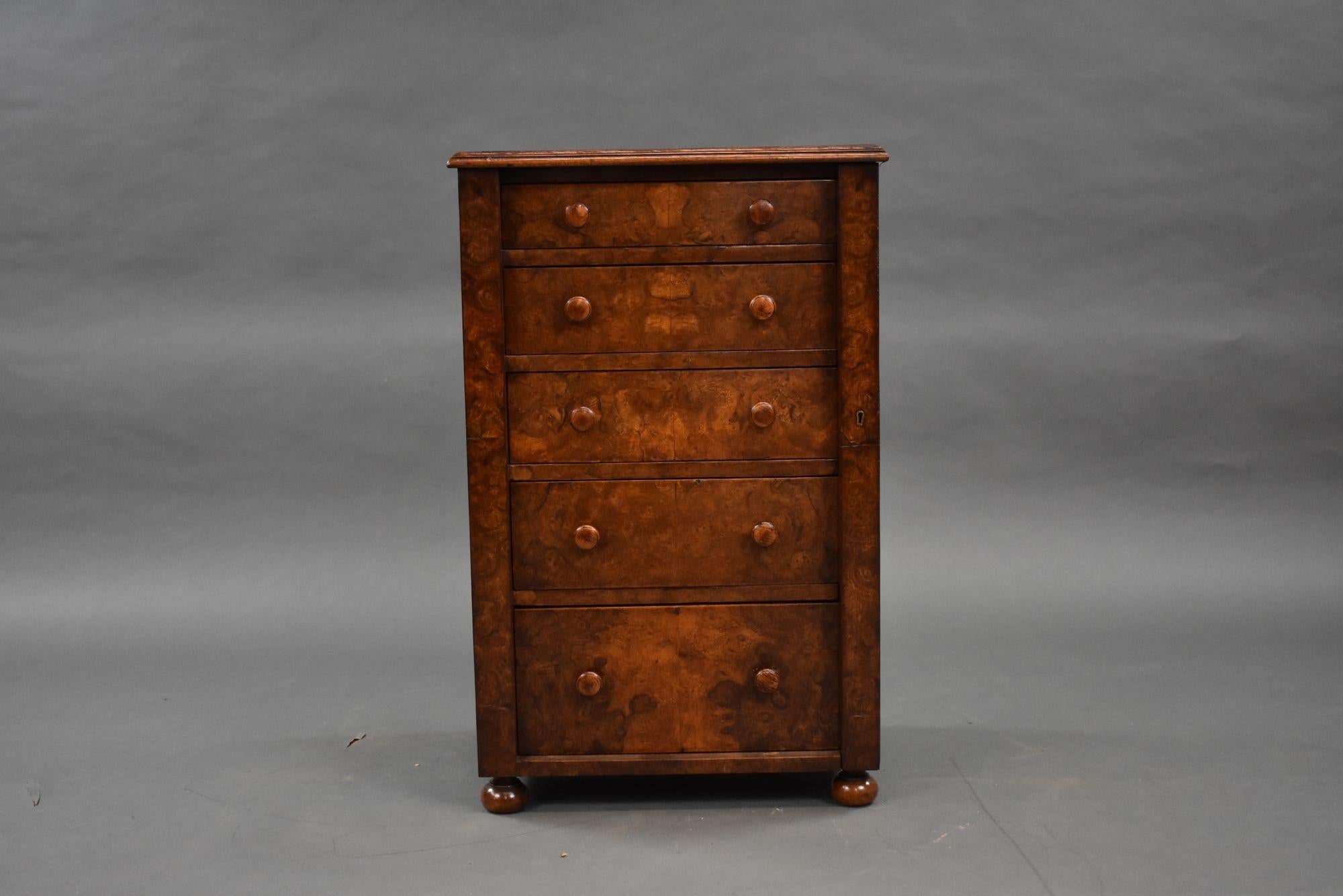 For sale is an antique burr walnut wellington chest, having a quarter veneered top over an arrangement of five graduated drawers, locked by a single side locker. The chest stands on bun feet and is in very good condition for its age.