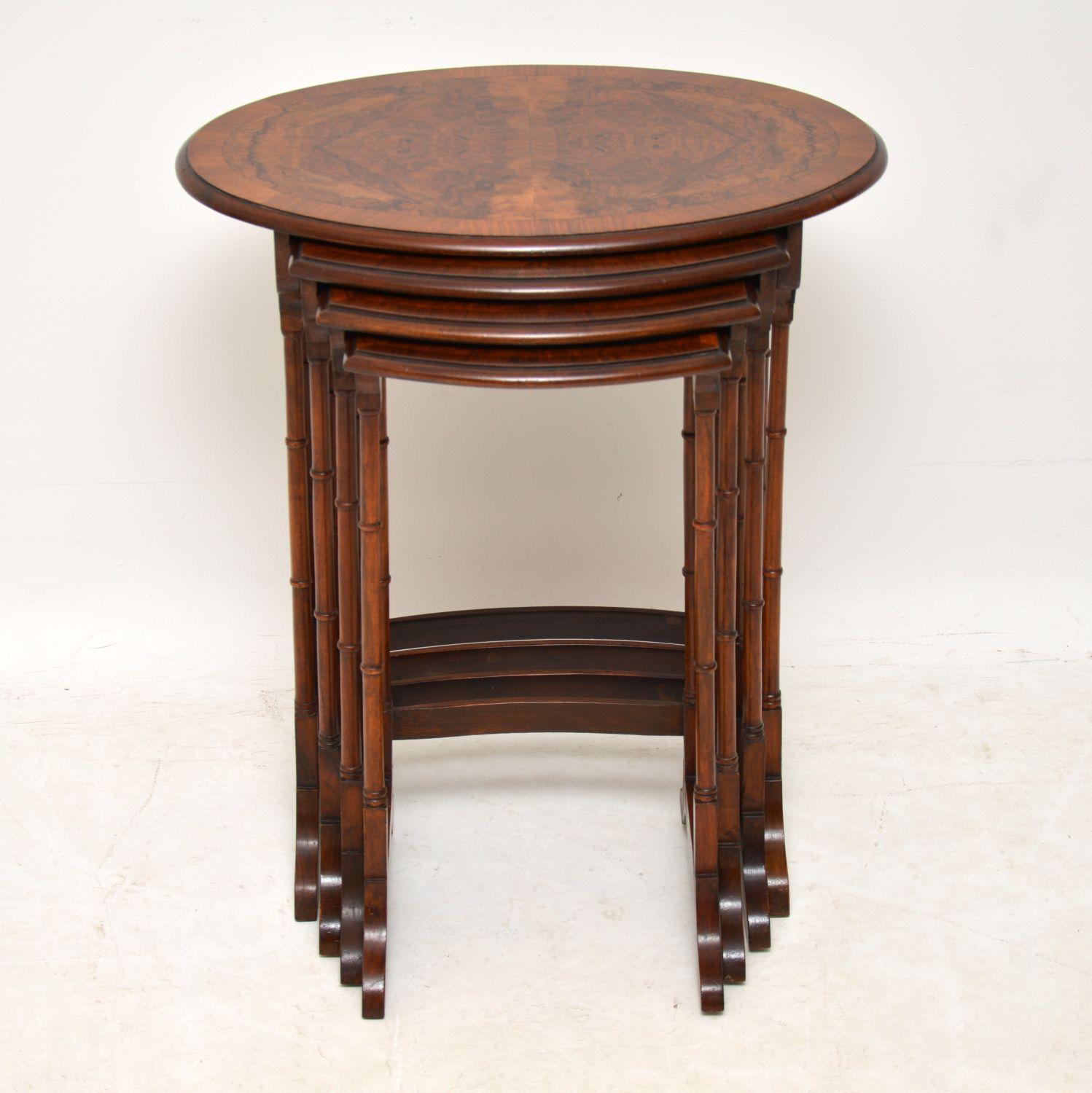 Antique Edwardian walnut nest of four tables in excellent condition, with beautifully figured burr walnut tops that are cross banded on the edges. The patterns on each top are different and exquisite. They have turned walnut legs with curved
