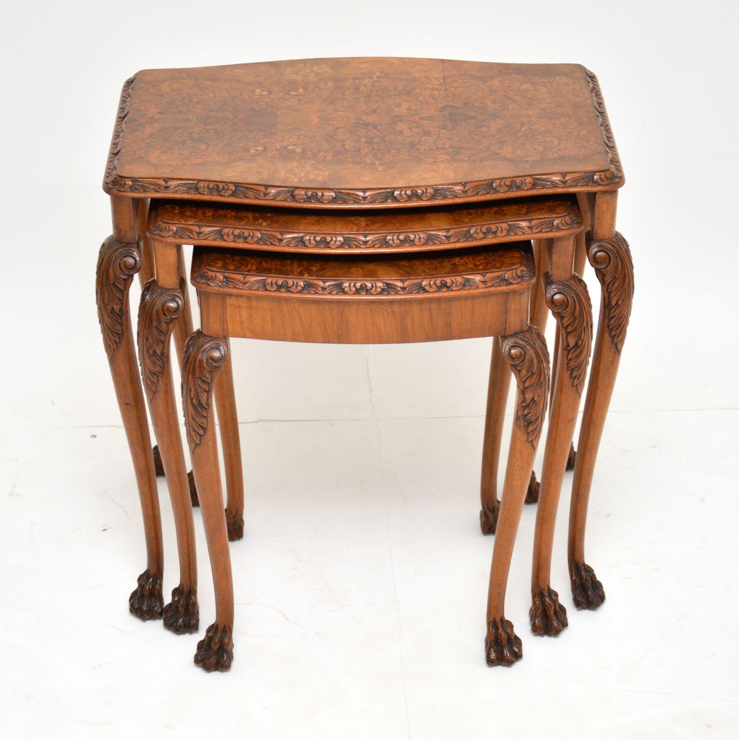 This antique Queen Anne style walnut nest of three tables is very good quality, in good condition & dates from around the 1930’s period.

The shaped table tops are a tight burr walnut, with fine carvings around the edges. There are more fine