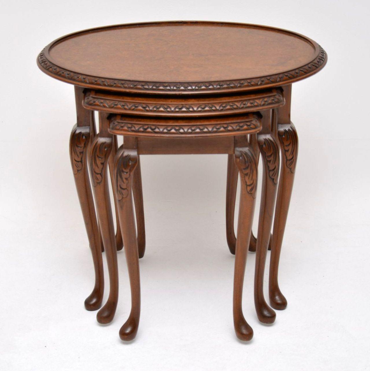 Antique Queen Anne style walnut nest of tables, dating from circa 1930s period and in excellent condition. The table tops are a tight burr walnut and have carved edges. Each tabletop has a different shape and the smallest one is quite deep. The