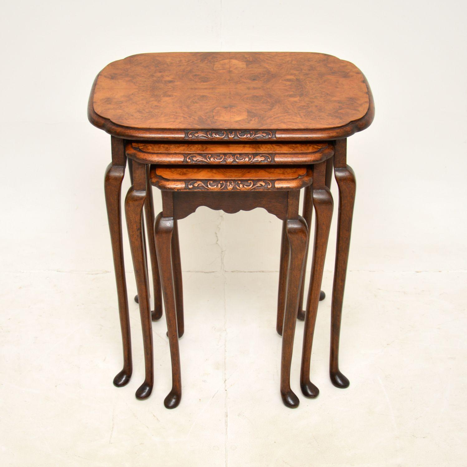 A beautiful set of three antique walnut nesting tables. They were made in England, and they date from around the 1920’s period.

The quality is fantastic, they are a very useful size with stunning burr walnut grain patterns and beautifully carved