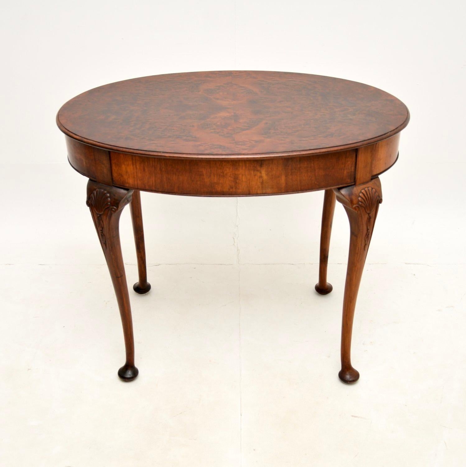 A stunning antique burr walnut occasional table. This was made in England, it dates from around the 1900-1910 period.

It is of superb quality, the oval top has gorgeous burr walnut grain patterns. This sits on slender yet sturdy cabriole legs with