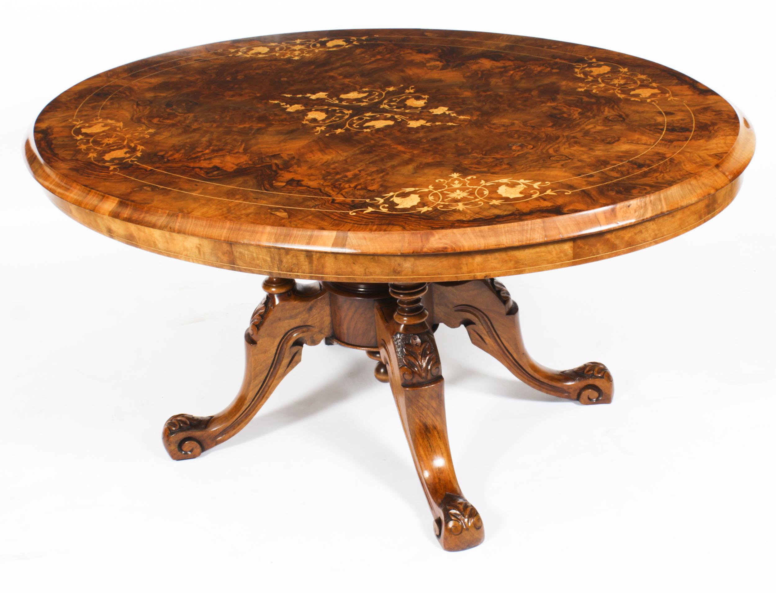 This is a lovely antique Victorian burr walnut and marquetry coffee table, circa 1860 in date
 
The oval table top features beautiful inlaid marquetry decoration in a beautifully figured ‘mirrored’ walnut veneer.
 
The base has been hand carved
