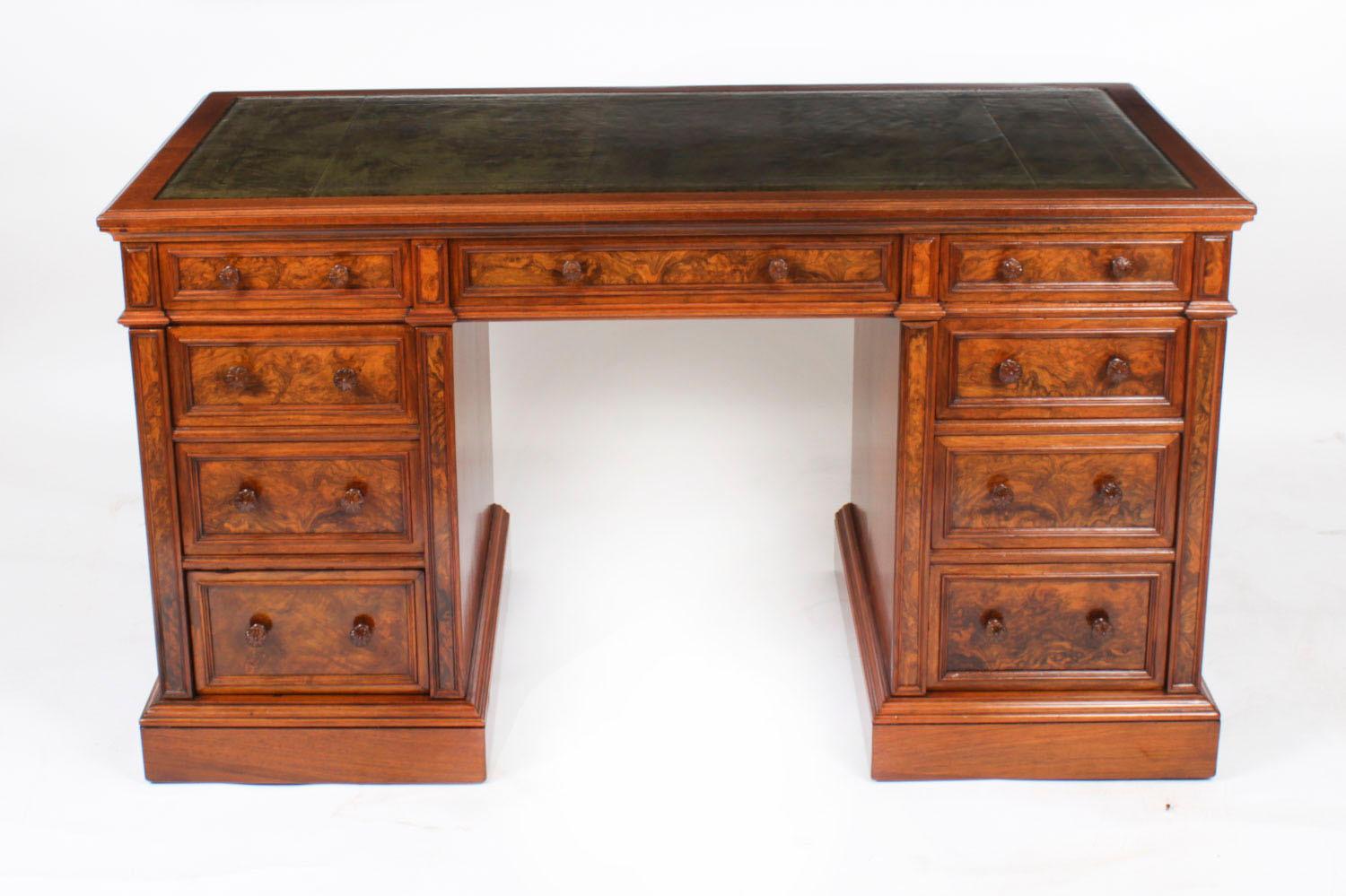 This is a superb antique Victorian burr walnut pedestal desk, by the world renowned cabinet maker, Gillow & Co, Circa 1880 in date.
 
It is made from fabulous burr walnut, which has a the rectangular top inset with a fabulous green and gold tooled