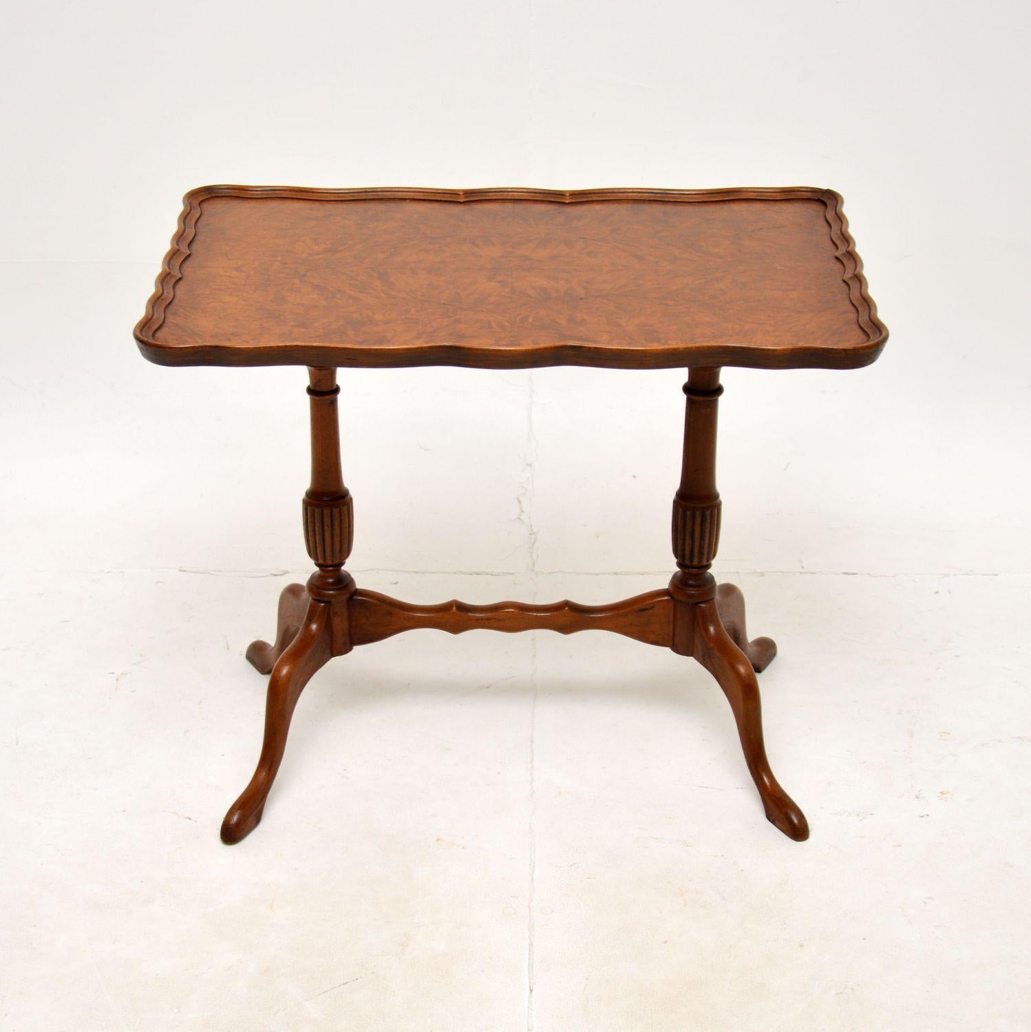 A lovely antique burr walnut pie crust coffee / side table. This was made in England, it dates from around the 1930-50’s.

The quality is superb and this is a very useful size to be used as a coffee table or a side table. The rectangular top has a
