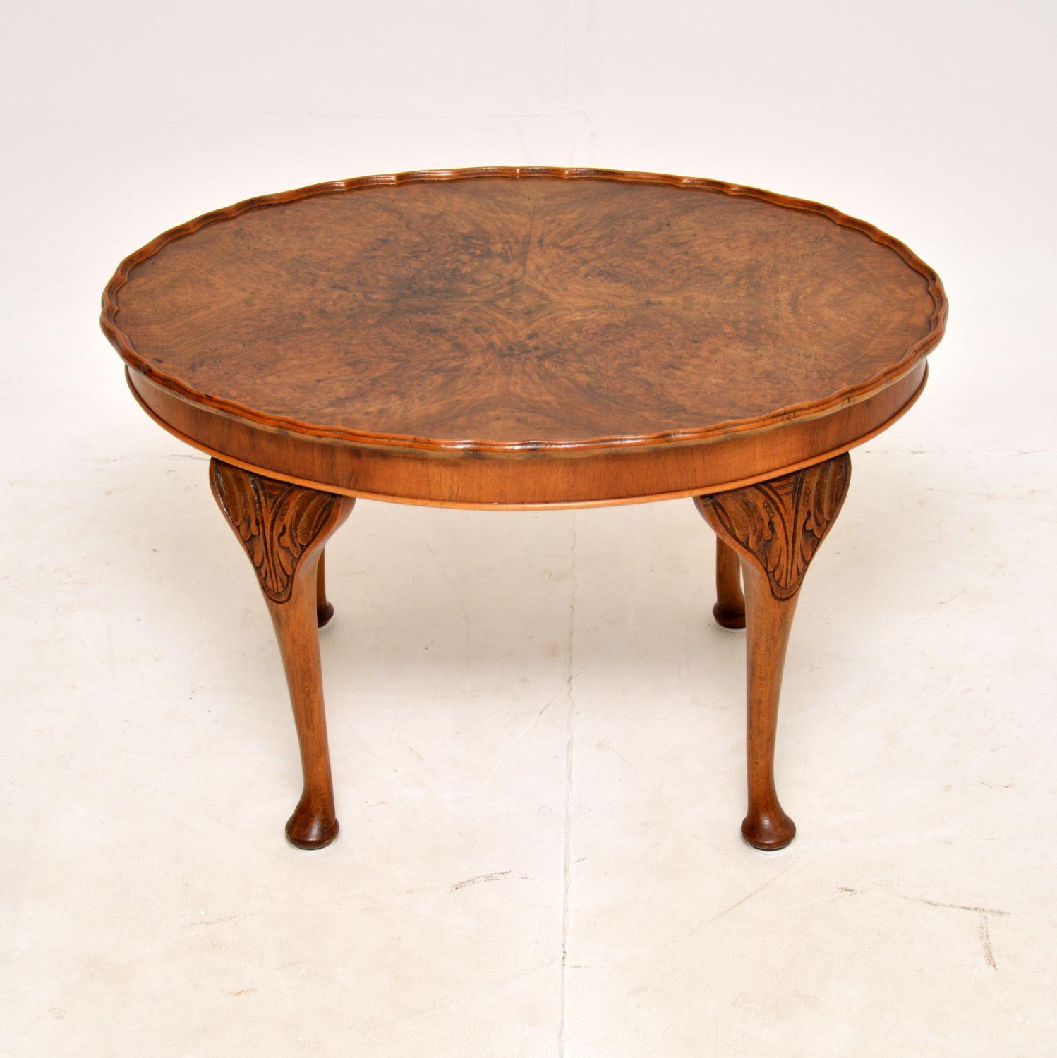 A gorgeous antique walnut oval coffee table with a raised pie crust edge. This was made in England, it dates from around the 1930’s.

It is a lovely size and is of great quality. The top has stunning burr walnut grain patterns, this sits on cabriole
