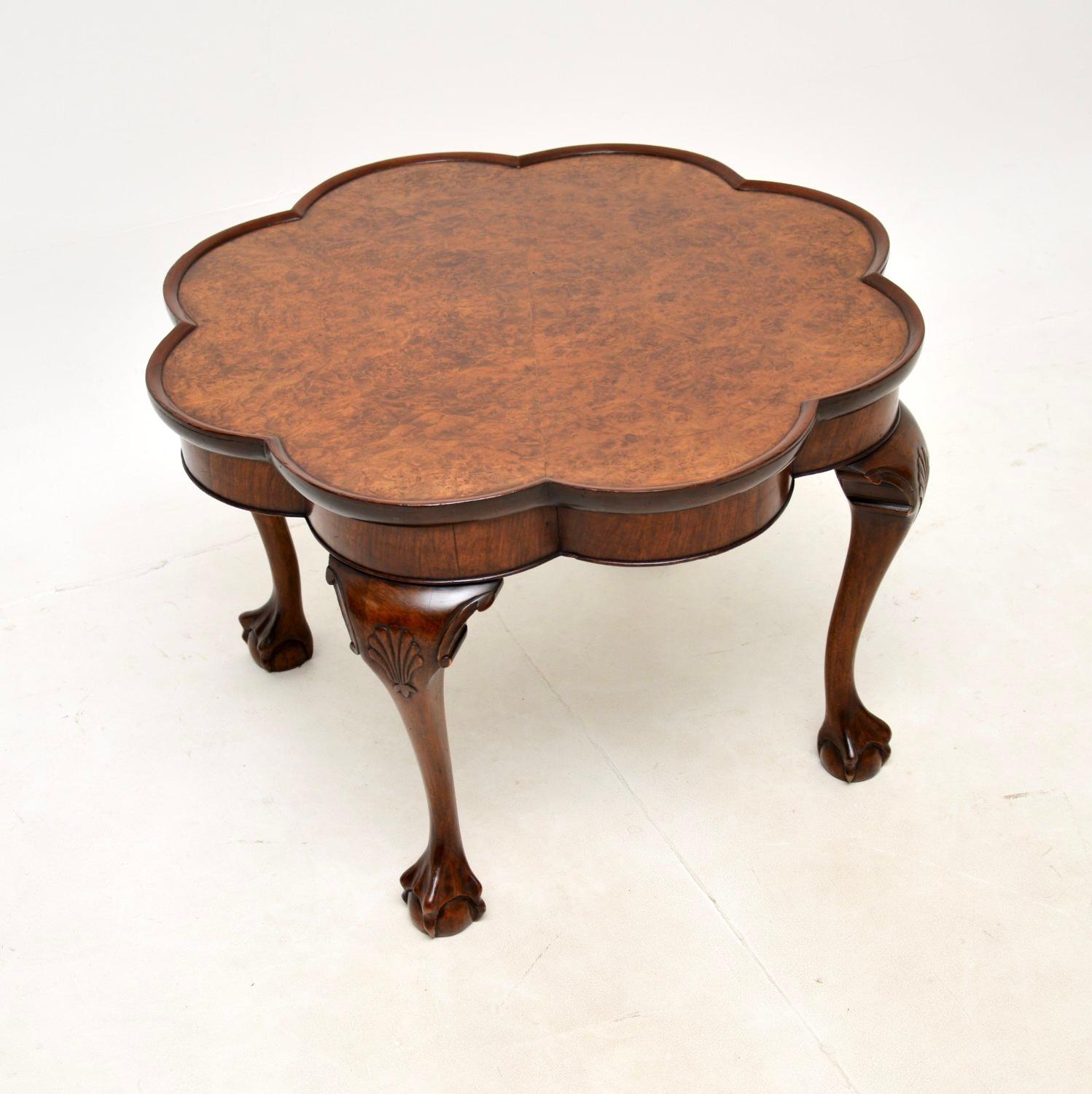A fantastic antique burr walnut pie crust coffee table. This was made in England, it dates from the 1920-30’s.

The quality is outstanding, this is beautifully made and is a lovely size. The top has a flower shaped design with a raised pie crust