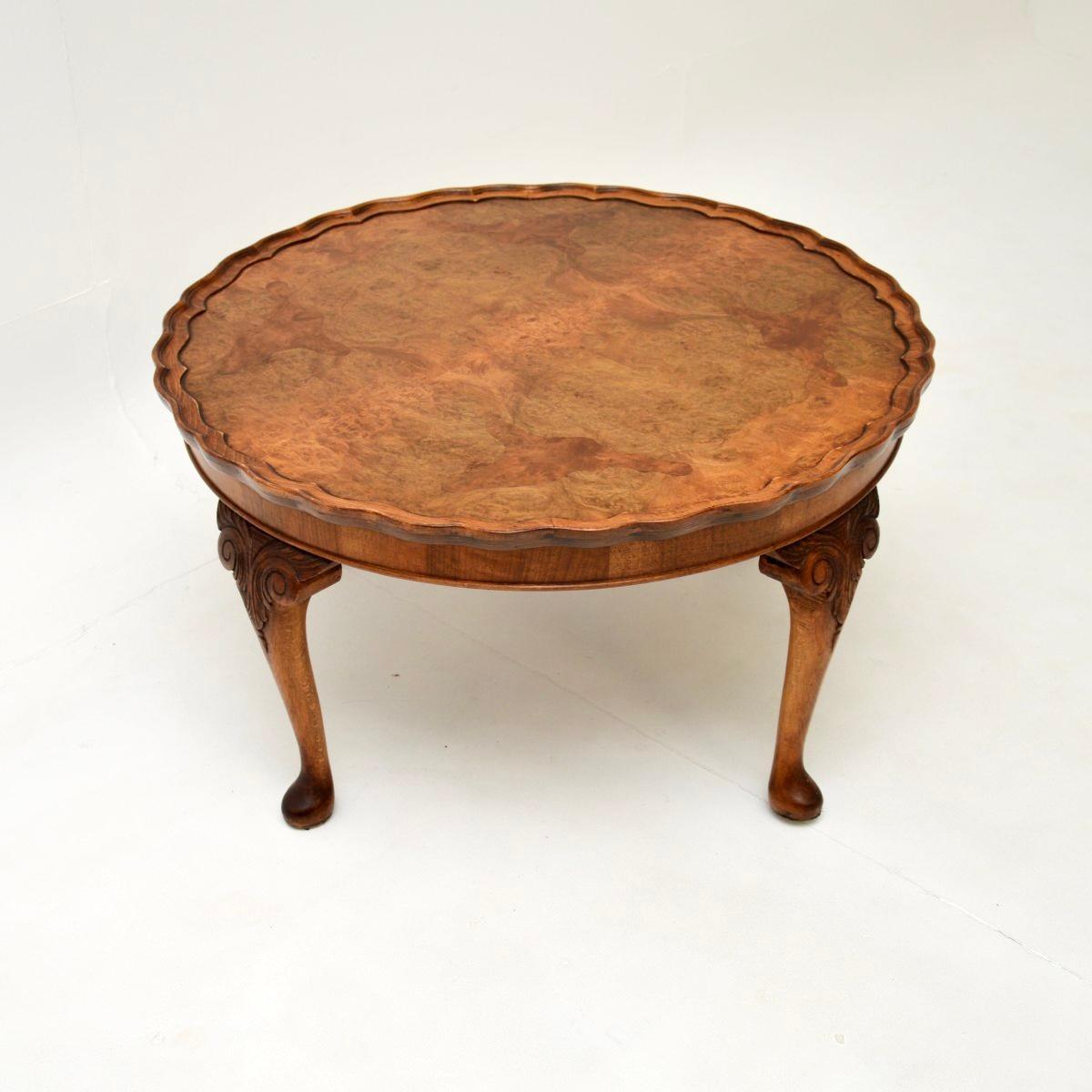 A large and impressive antique burr walnut pie crust coffee table. This was made in England, it dates from the 1920-30’s.

It is of very good quality and is a very useful size. The large circular top has stunning burr walnut grain patterns, this