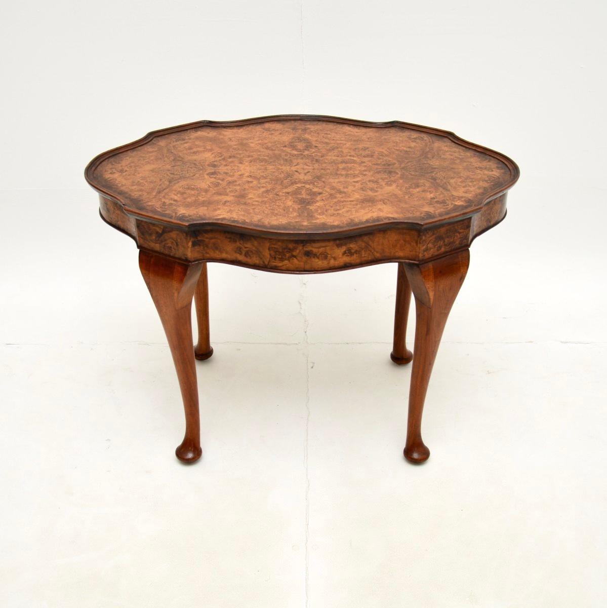 A gorgeous antique burr walnut pie crust coffee table. This was made in England, it dates from around the 1930’s.

It is a lovely size and is of great quality. The top has a serpentine shaped edge and stunning burr walnut grain patterns. This sits