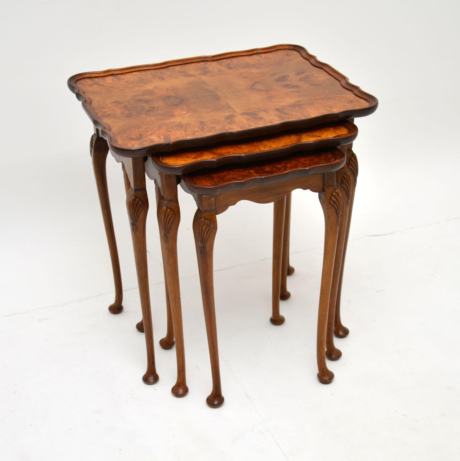 A wonderful original antique set of three nesting tables with burr walnut tops. These were made in England & date from around the 1930’s period.

They are beautifully made, with gorgeous shaped pie crust tops edges. There are shell carvings on the