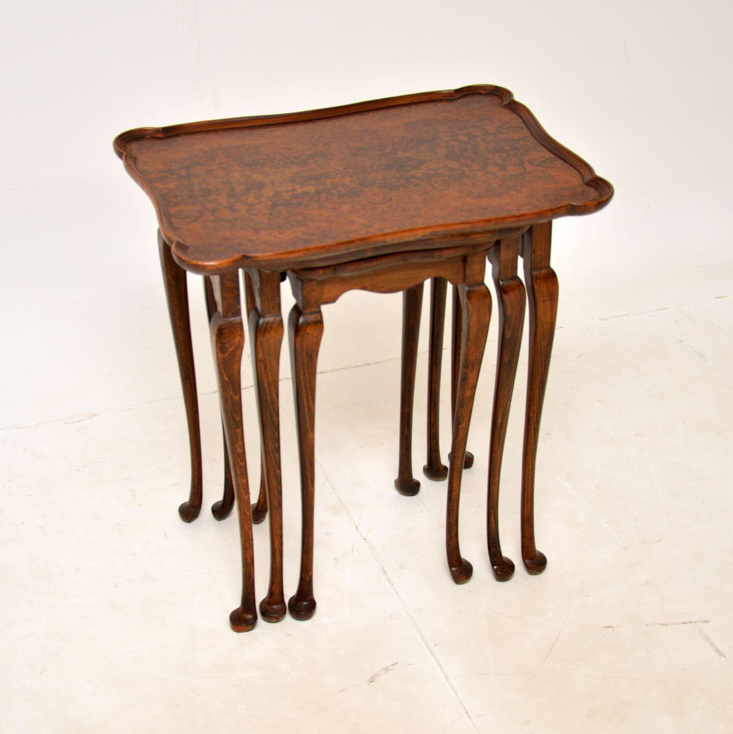 A lovely set of antique walnut nesting tables with pie crust tops. They were made in England, and date from around the 1900-1910 period.

They are of good quality, with stunning burr walnut grain patterns on the tops. They sit on elegant cabriole