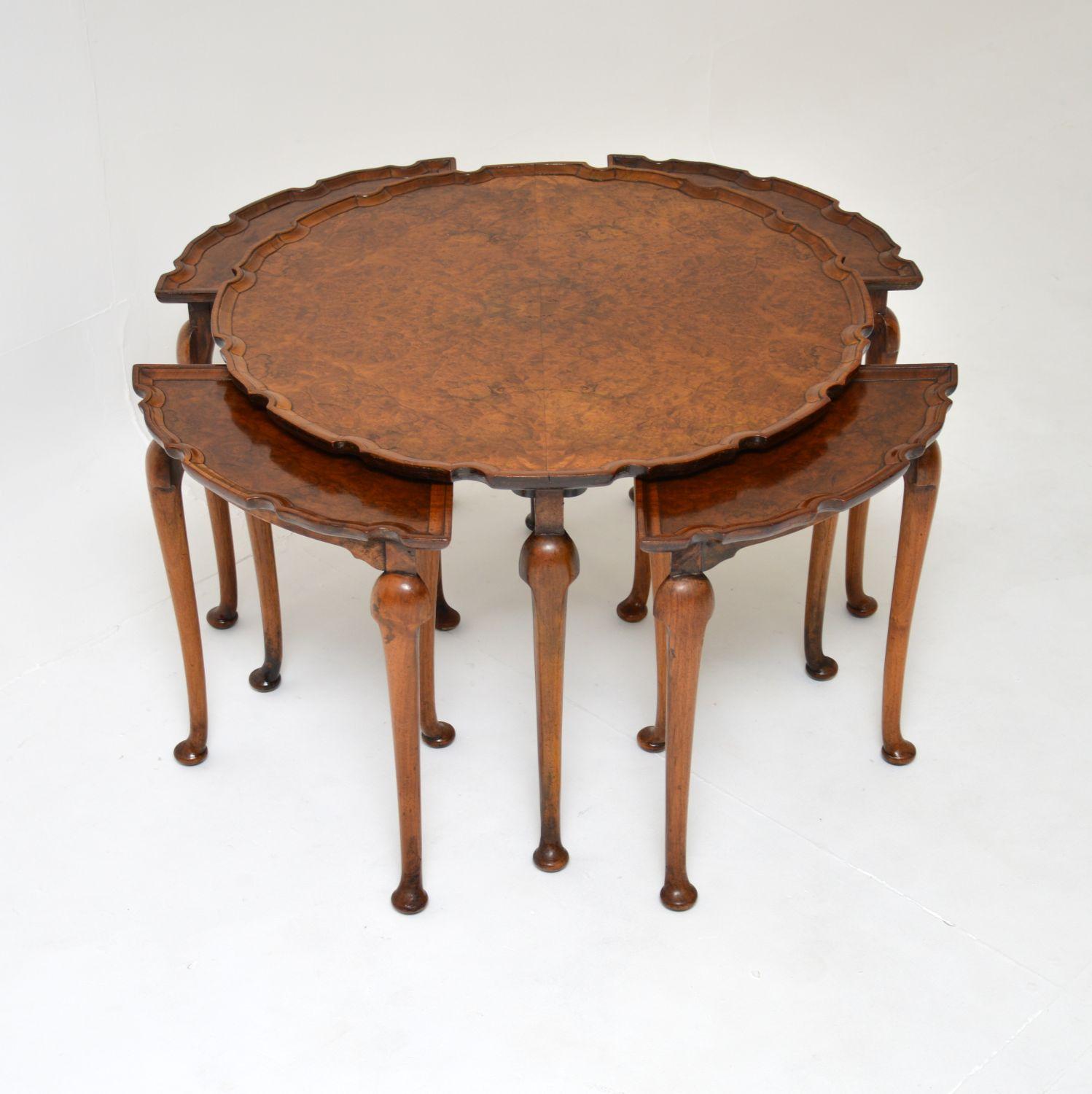 A beautiful and very useful antique burr walnut pie crust nesting coffee table. This was made in England, it dates from around the 1900-1920 period.

It is of superb quality, with a fine, elegant yet sturdy design. The larger circular coffee table