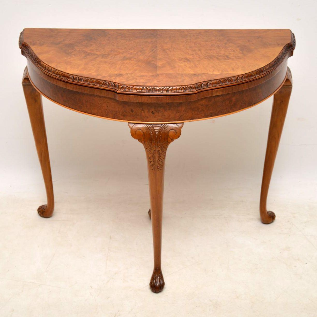 Antique walnut Queen Anne style card table in good original and with a lovely mellow color, dating from around the 1920s period. The shaped top and front section are burr walnut. The top edge and solid walnut legs are well carved. I believe the
