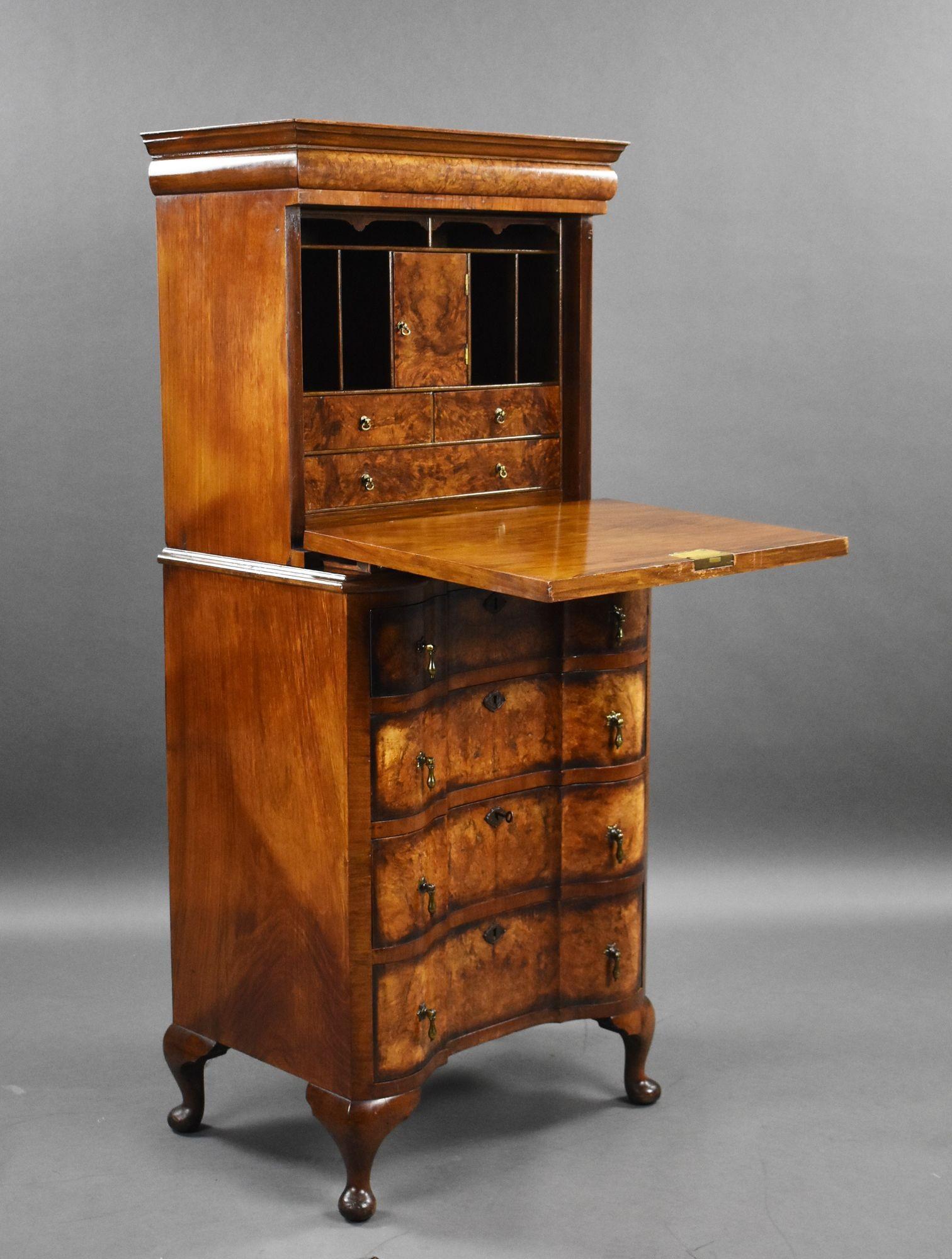 For sale is a very good quality antique burr walnut Queen Anne style escritoire, having a secret drawer in the top, above a fall front opening to a fully fitted interior and writing surface, over a serpentine chest of drawers, with original brass