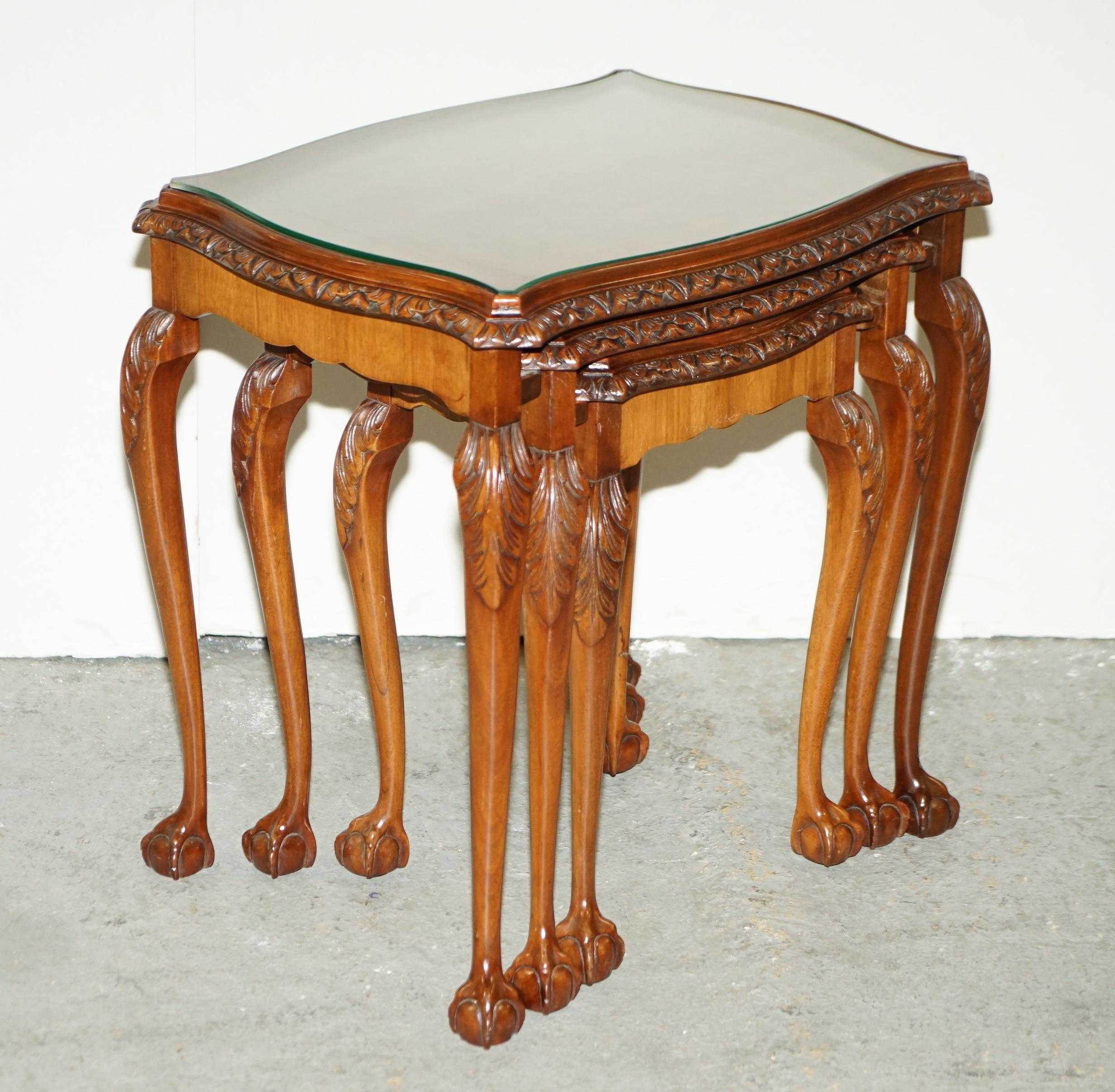 Here we have for sale a lovely burr walnut serpentine nest of 3 stacking tables with glass tops standing on claw and ball feet and heavily carved detailing.

Overall, the tables are in very good condition they have been cleaned and polished ready