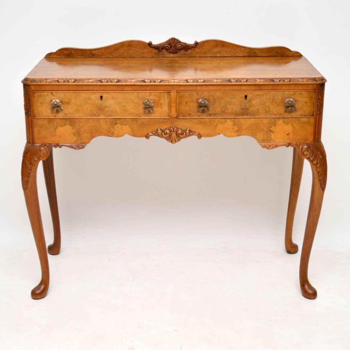 Fine quality and impressive walnut server side table in excellent original condition. The carved back section, the top and the front is all burr walnut with some lovely patterns. There are Fine carvings around the top edge, the sides, the middle and
