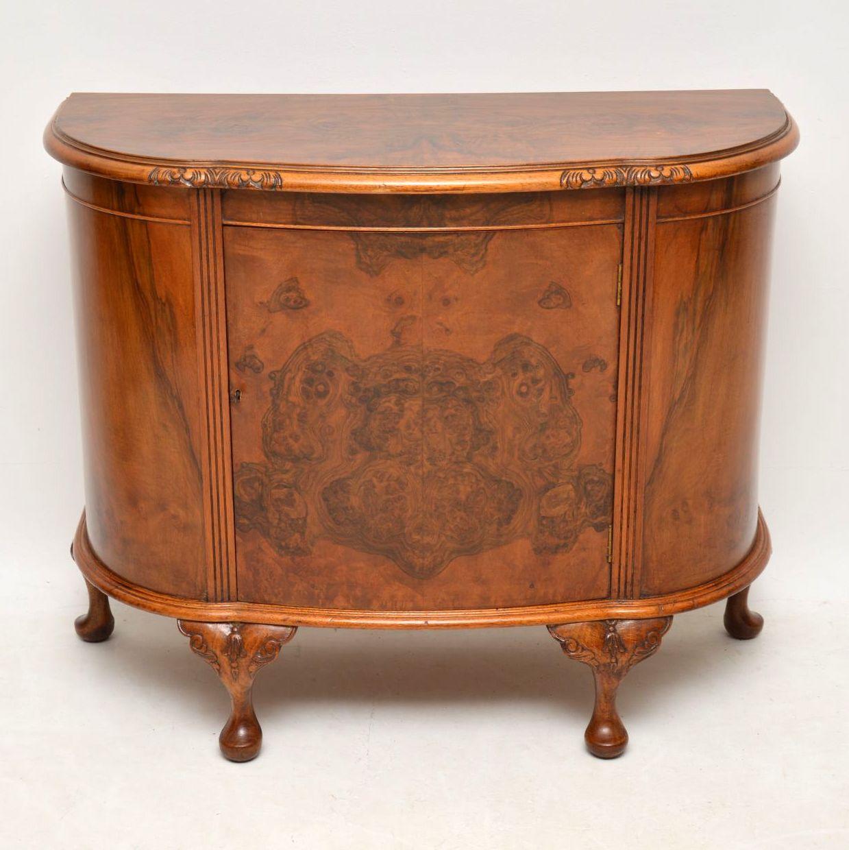 This antique walnut side cabinet has a serpentine shaped front with a burr walnut top and front. It’s in excellent condition and has just been French polished. The figuring on the veneers shows some beautiful patterns. It also has a carved top edge,