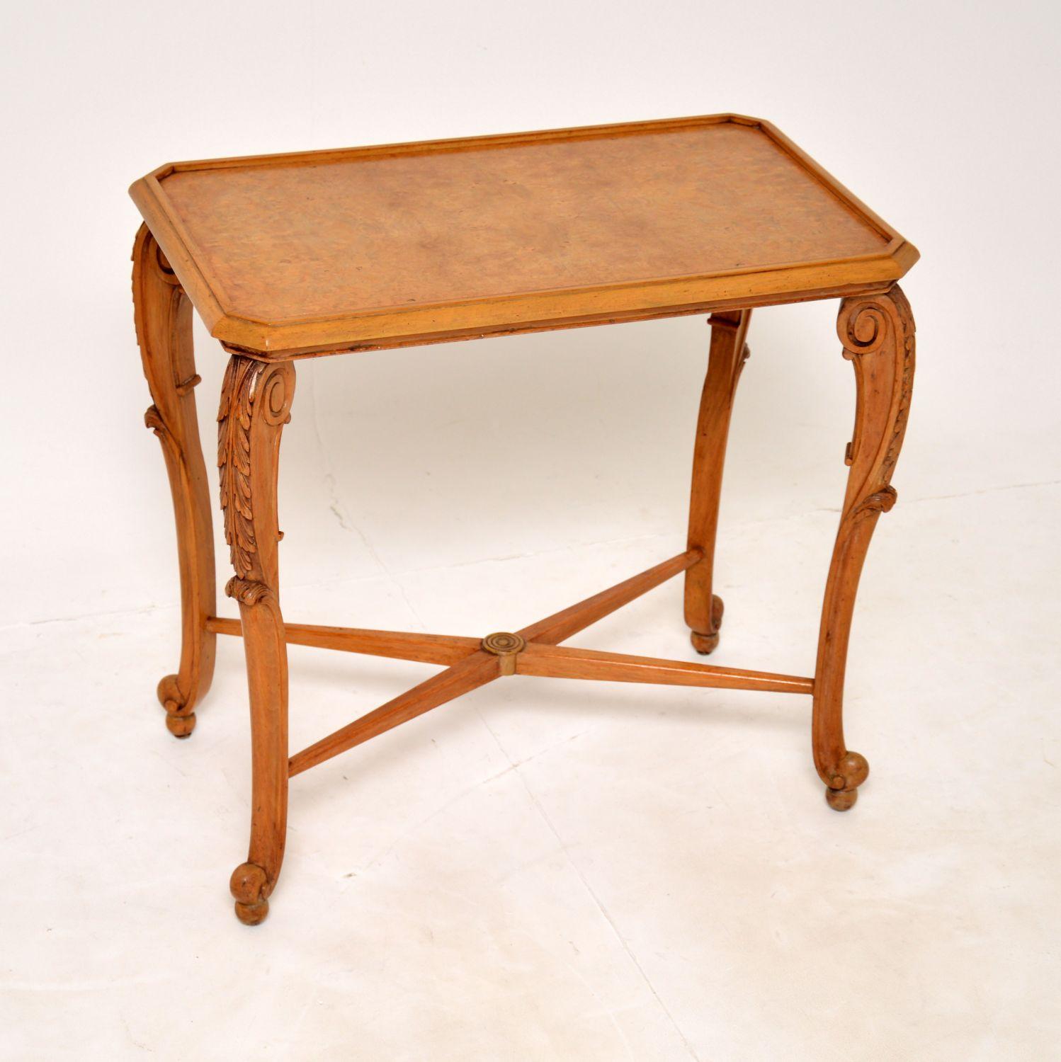A lovely antique side table in burr walnut and carved walnut. This was made in England by Ray and Solomon Hille, it dates from the 1930’s.

It is beautifully made and is a useful size for use as an occasional side table or lamp table. There is a