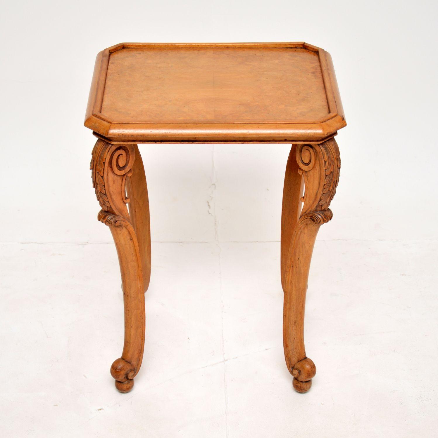 A lovely small antique side table in burr walnut and carved walnut. This was made in England by Ray and Solomon Hille, it dates from the 1930’s.

It is beautifully made and is a useful size for use as an occasional side table or lamp table. There