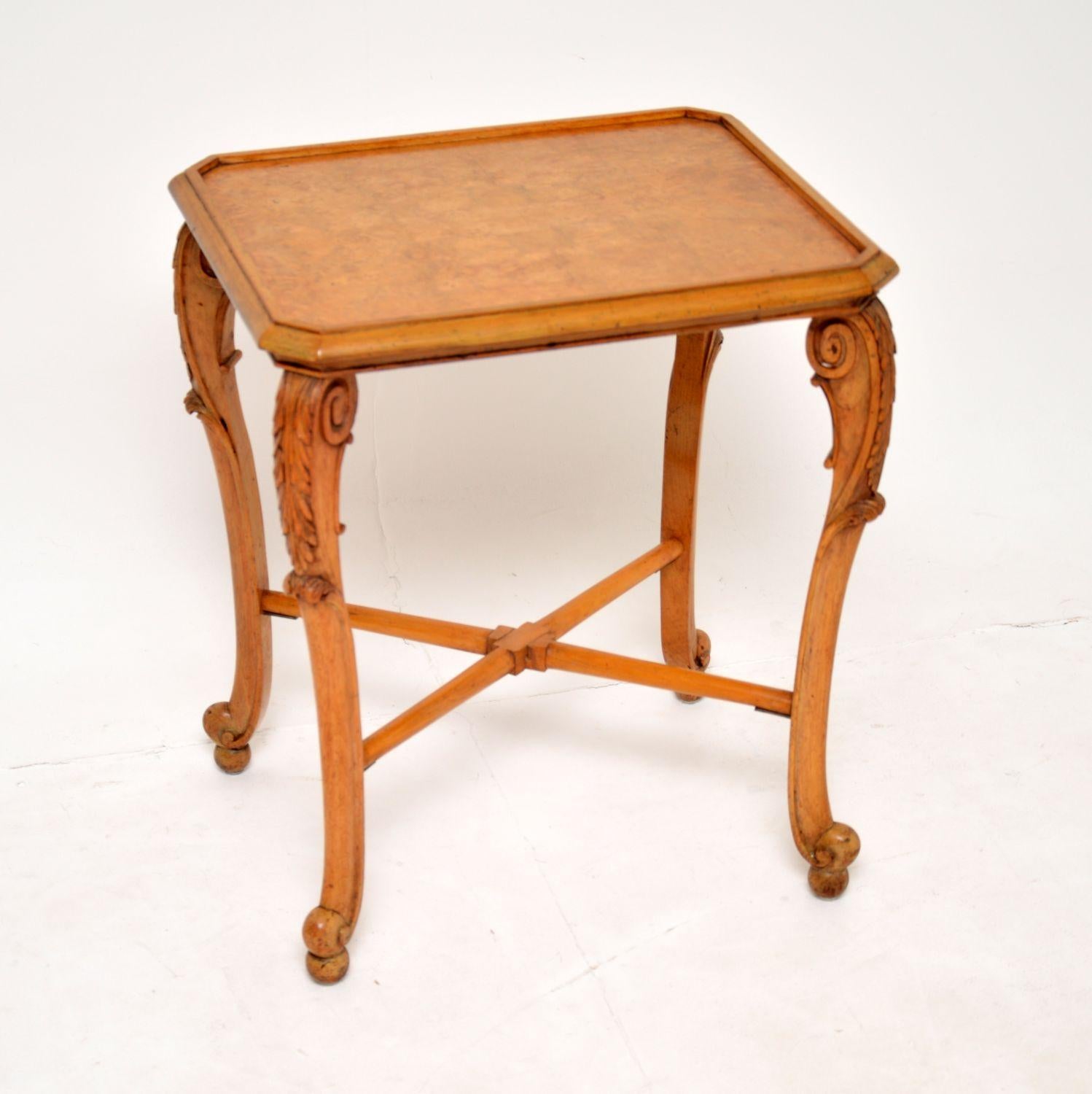 A lovely antique side table in burr walnut and carved walnut. This was made in England by Ray and Solomon Hille, it dates from the 1930’s.

It is beautifully made and is a useful size for use as an occasional side table or lamp table. There is a