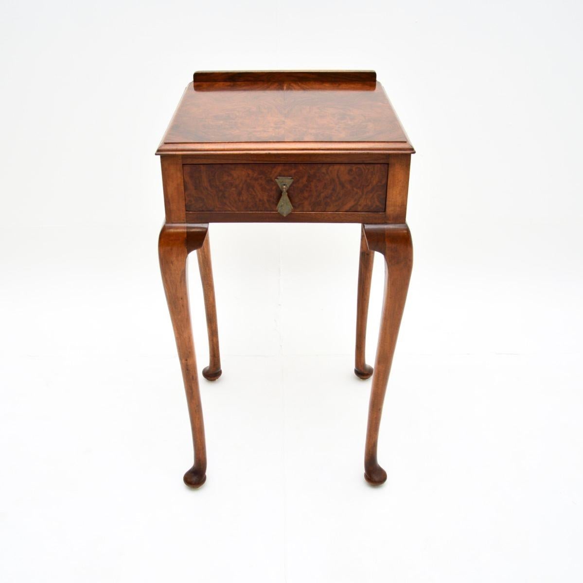 A lovely antique burr walnut side table, made in England and dating from around the 1920’s period.

The quality is superb, this is a very well made and useful item. There is a single drawer with fine, hand cut dovetailed joints. This stands on