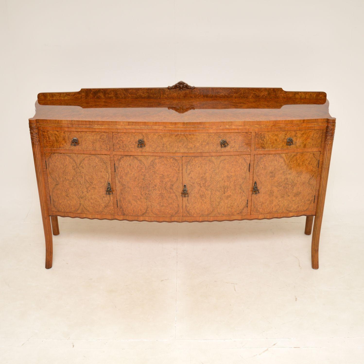 A stunning and extremely well made sideboard in burr walnut. This was made in England, it dates from around the 1920’s & it’s very much the unique style of that period.

The quality is outstanding, this has absolutely gorgeous burr walnut grain