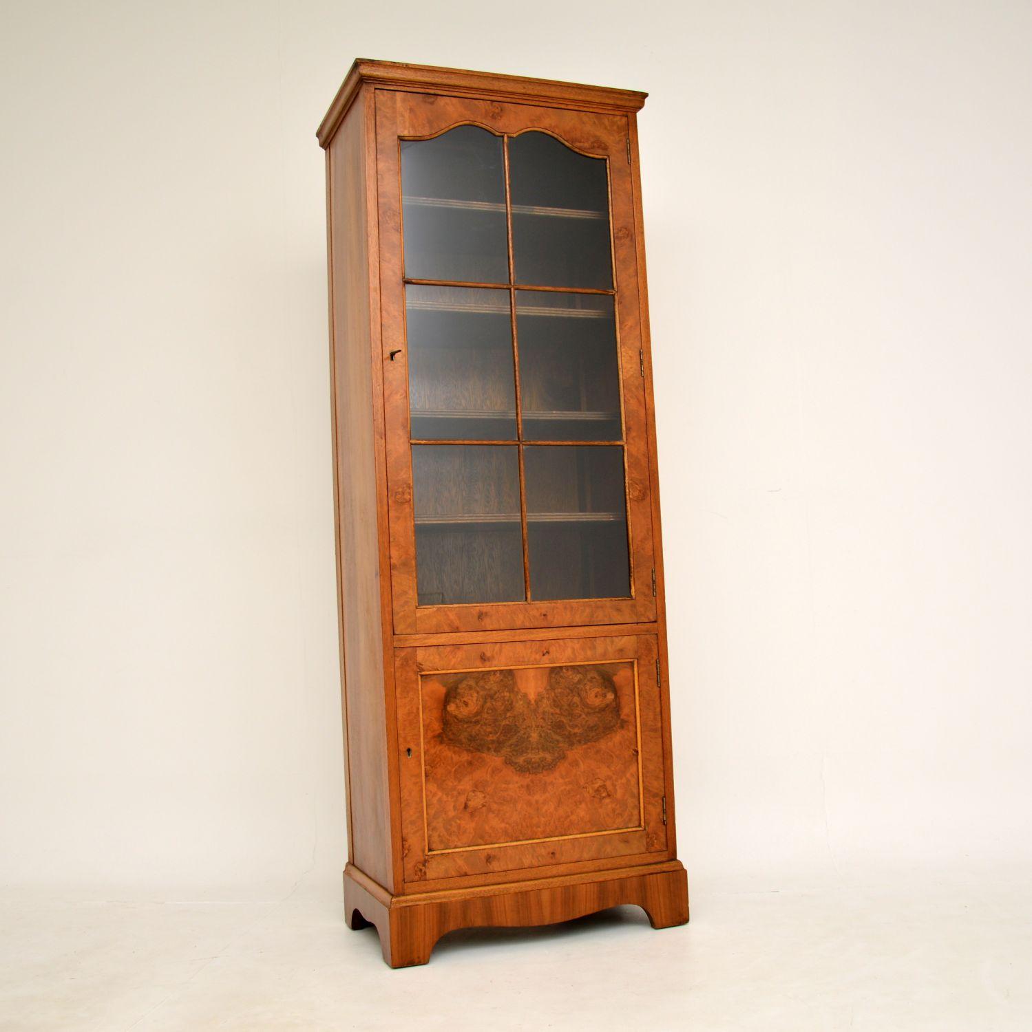 An excellent antique walnut bookcase of lovely proportions. This was made in England, it dates from around the 1930’s period.

It is a very useful size, tall and slim, offering lots of storage space while taking up little floor space. The astral