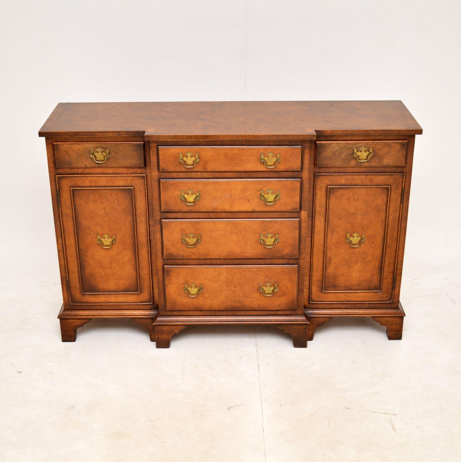 A fantastic and compact breakfront sideboard, beautifully made from burr walnut. This was made in England, it dates from around the 1930s period.

It is a very useful size and has a very smart design. The quality is superb, with gorgeous burr