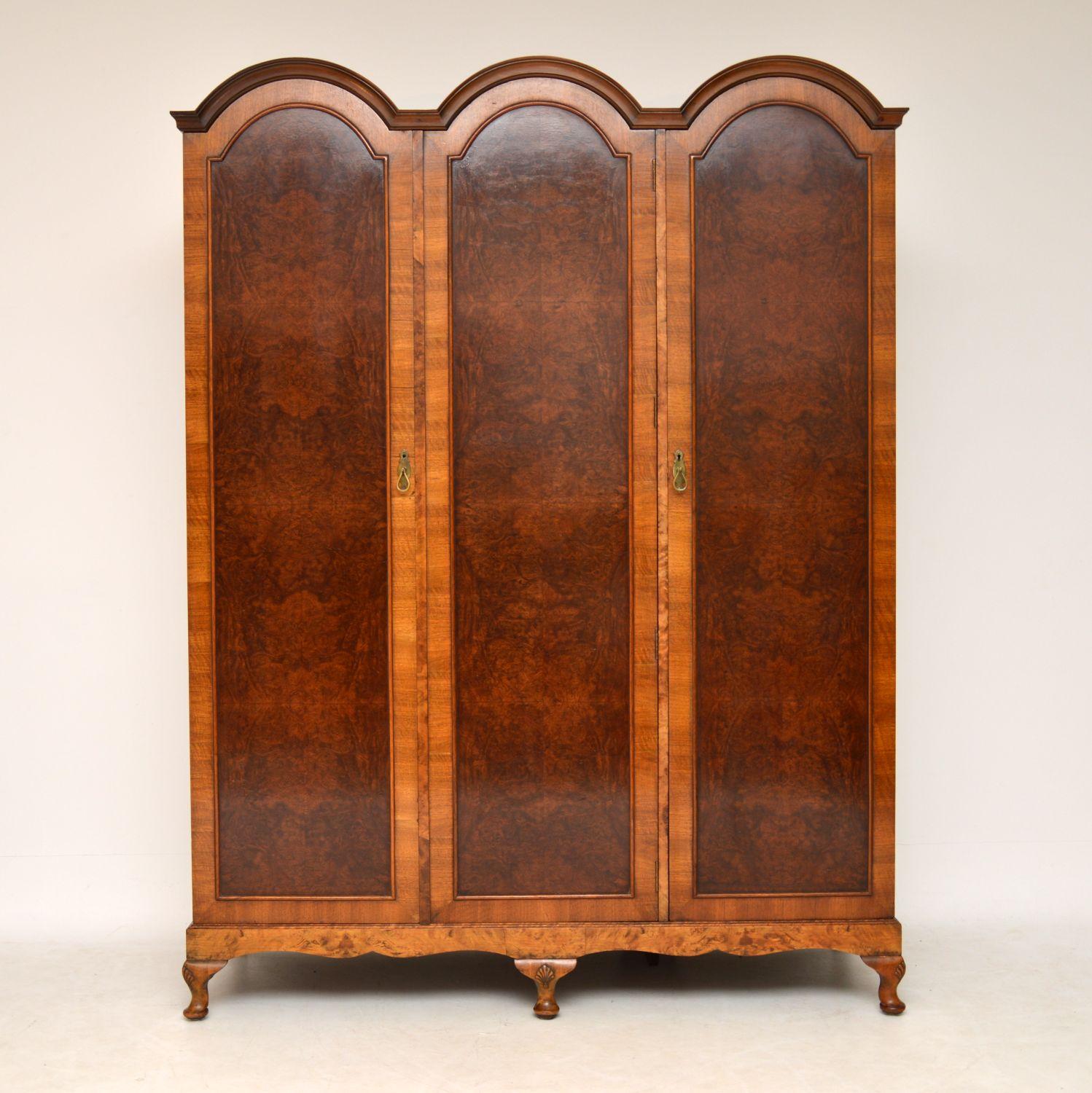Very impressive antique burr walnut triple arched three door wardrobe in excellent condition, having just been French polished. It’s a very practicable piece of furniture with everything you could need inside. There’s a double hanging space with a