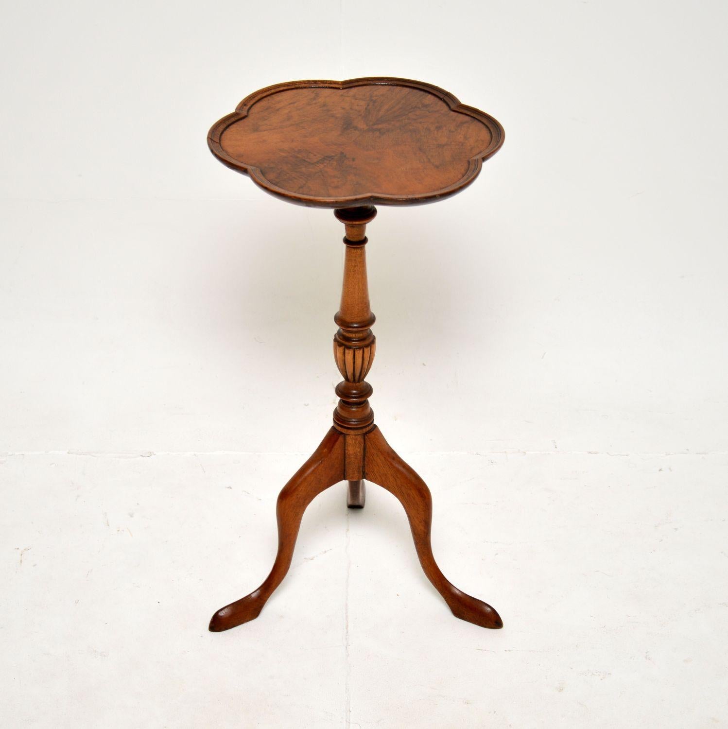 A lovely antique burr walnut wine table. This was made in England, it dates from around the 1930’s.

It is of great quality and is a nice size. The top has a beautiful flower shape with curved edges, and stunning burr walnut grain patterns. This