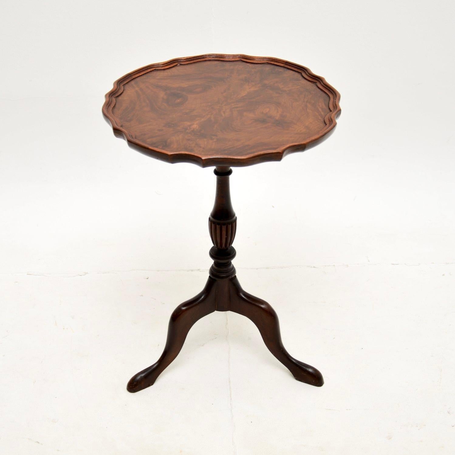 A beautiful and useful antique burr walnut wine table. This was made in England, it dates from around the 1930-50’s.

It is very well made and is a lovely size, perfect for use in various settings around the home. The top has a raised pie crust edge