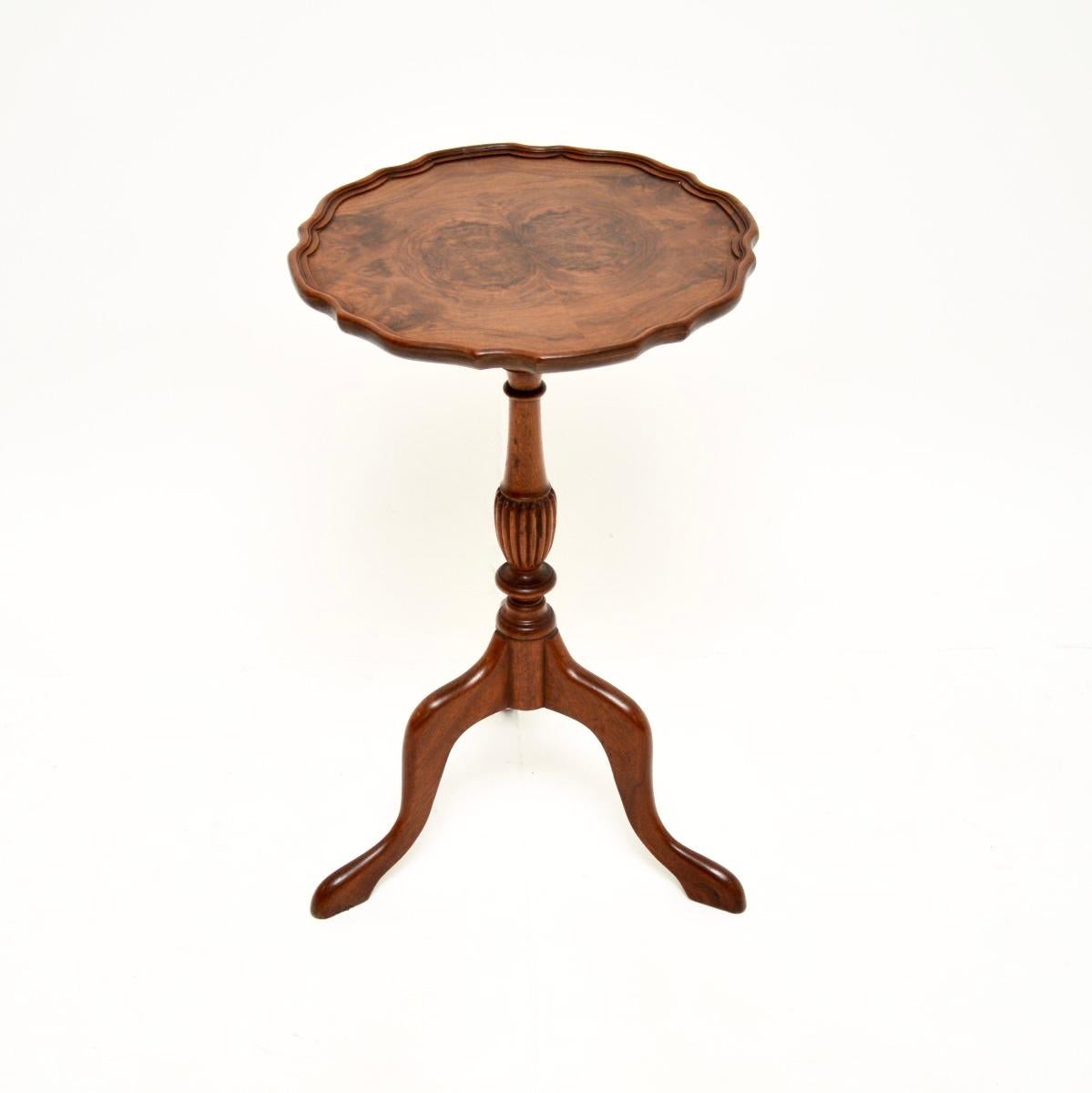 A beautiful and useful antique burr walnut wine table. This was made in England, it dates from around the 1930’s.

The quality is excellent, the top has stunning burr walnut grain patterns and a raised pie crust edge. It stands on a tripod base with