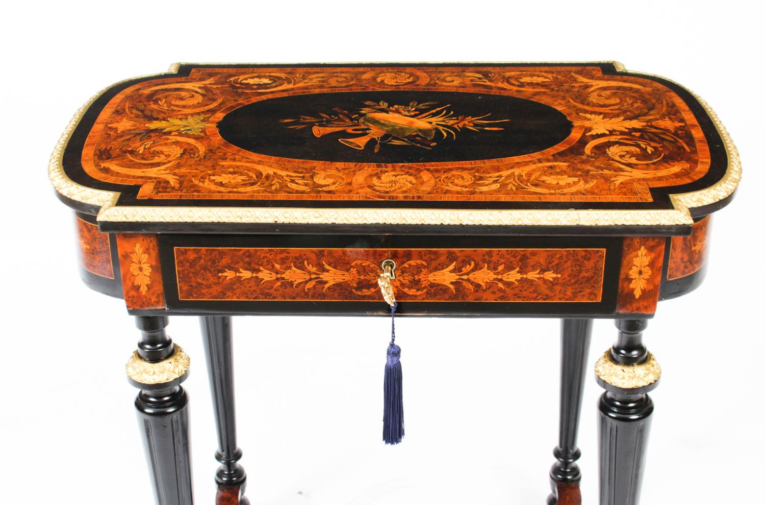 A superb burr walnut, marquetry and ebonised sewing table, Circa 1860 in date

The ornately floral marquetry inlaid lid with ormolu border enclosing a fitted interior with drawers and compartments and raised on tapering reeded legs joined by an H