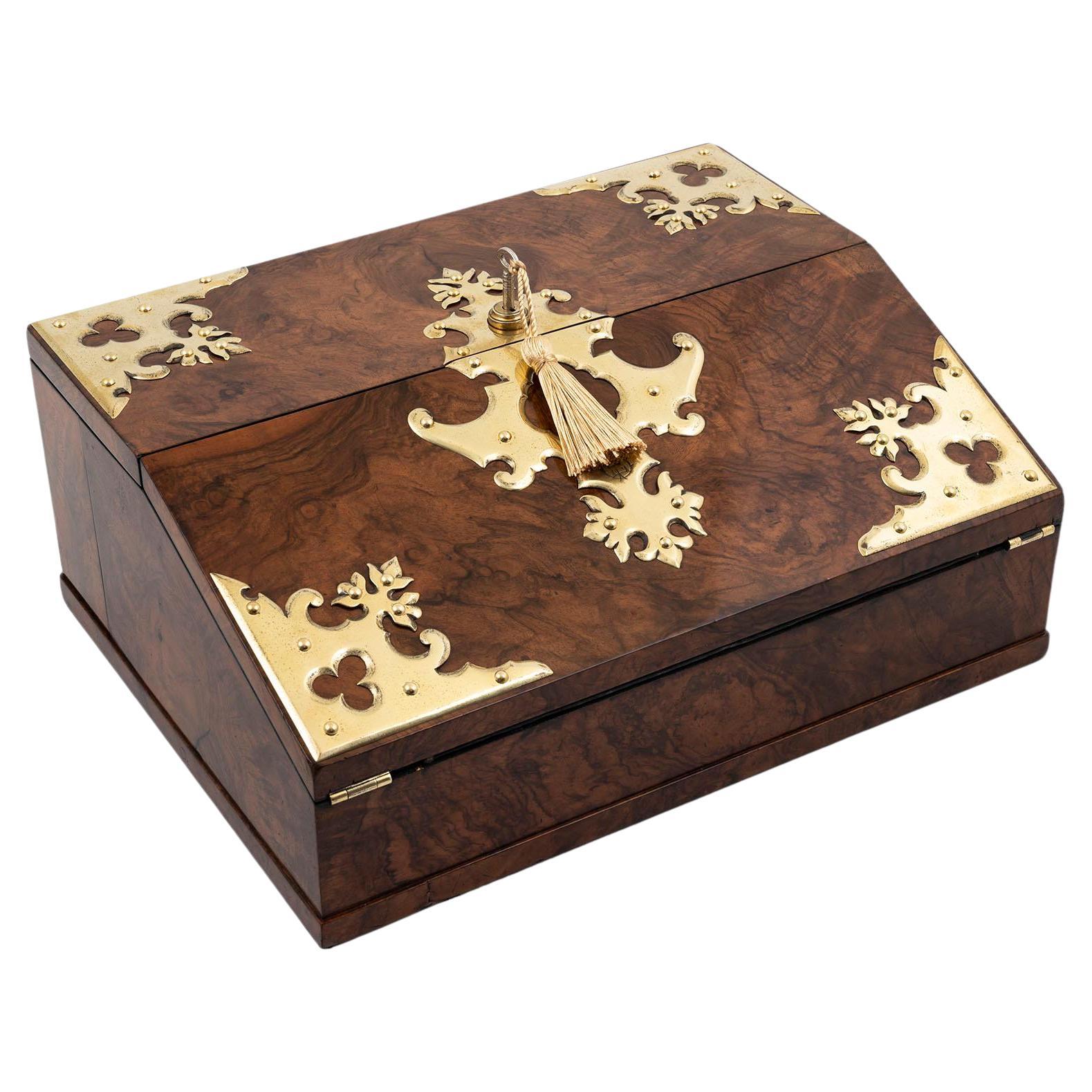 Retailed by Charles Henry, Manchester

From our Writing Box collection, we are delighted to offer this English Burr Walnut Writing Box by Betjemann. The Writing box of slim rectangular shape with a slightly sloped lid is veneered in exquisite Burr