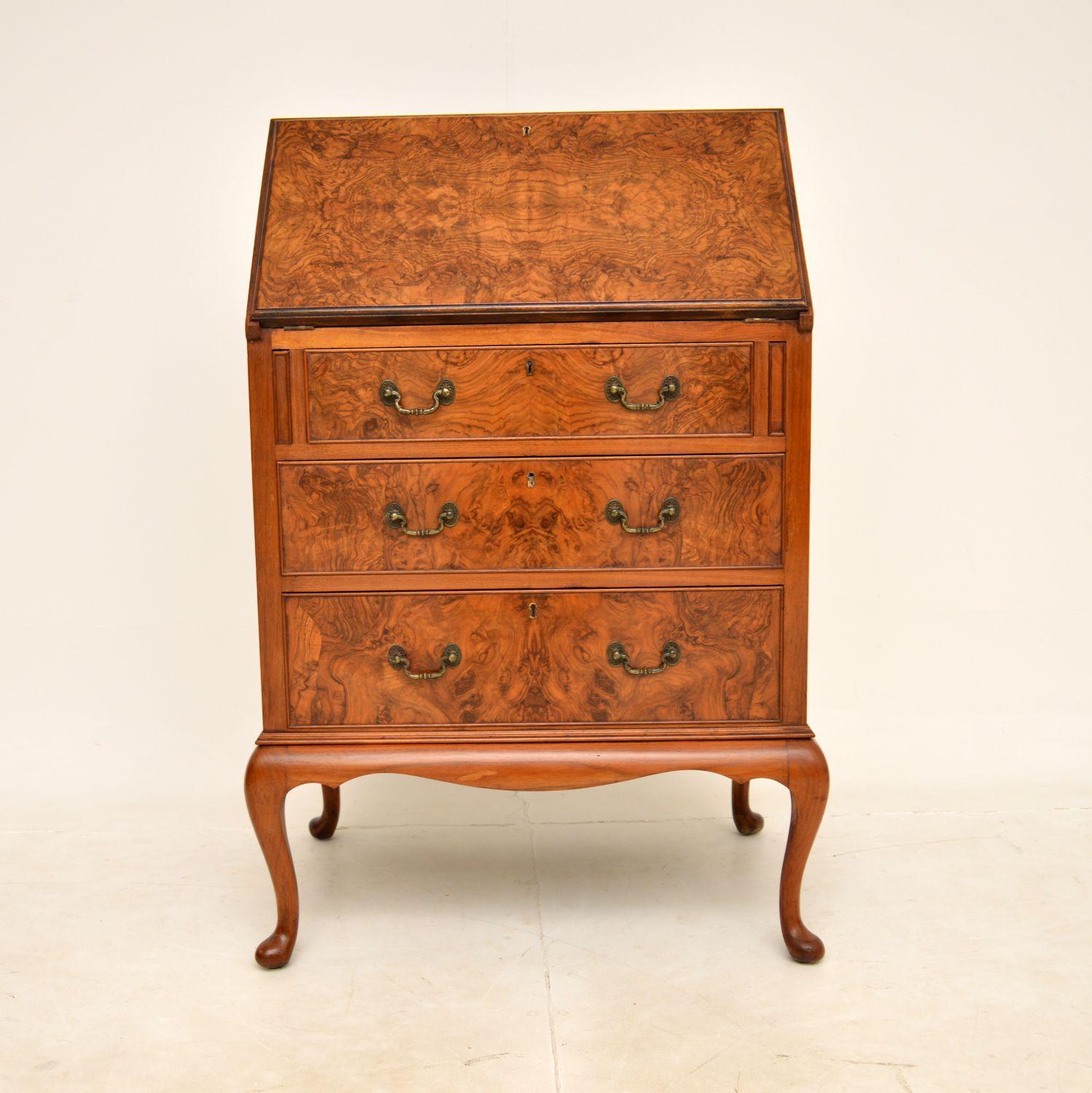 A top quality antique burr walnut writing bureau. This was made in England by Maple & Co, it dates from around the 1900-1910 period.

It is extremely well made and is a very useful item. There is a good sized leather top work space, internal