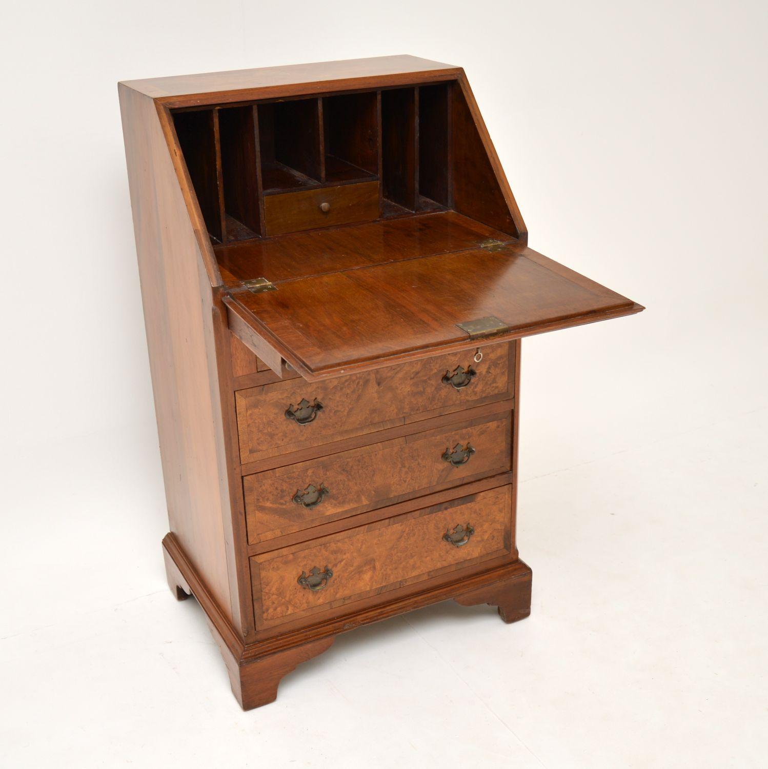 A smart and very useful antique writing bureau, beautifully made from burr walnut. This is in the antique Georgian style & dates from circa 1900s-1920s

It’s of very high quality and is a great size. It is slim and doesn’t take up too much space,