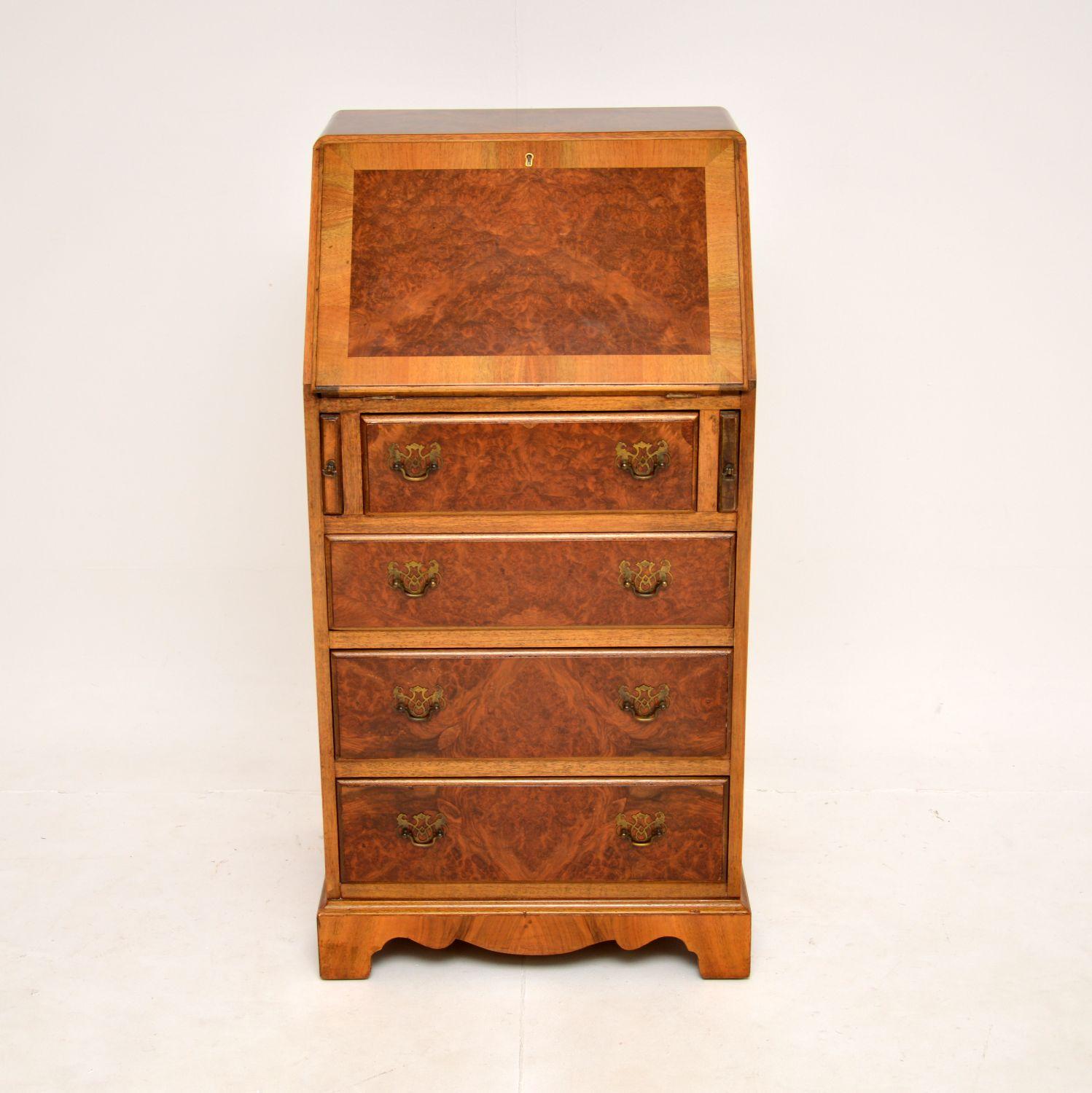 A wonderful antique burr walnut writing bureau in the Georgian style. This was made in England,it dates from around the 1930’s.

It is of great quality, with a very useful and practical design. It is slim and compact, with lots of storage space. The